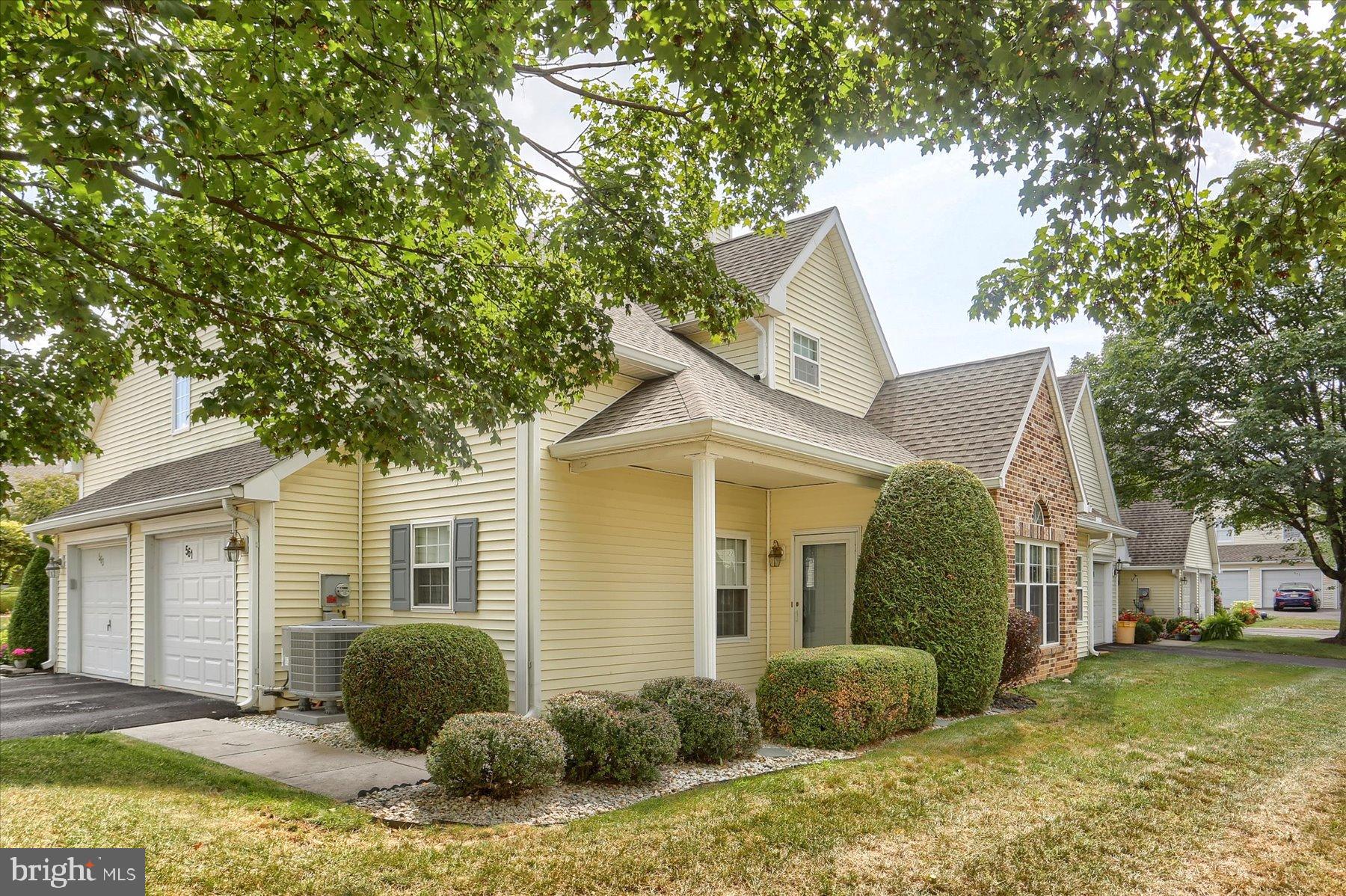 Nestled in the charming Brighton Place community, this exquisite end-of-row condo embodies the perfect blend of comfort and sophistication. Built in 1996, this cottage-style residence offers a warm and inviting atmosphere. Step inside to discover an open floor plan that seamlessly connects the living, dining, and kitchen areas, creating an ideal space for both relaxation and entertaining. The living room is anchored by a cozy propane fireplace, perfect for those chilly evenings. At the same time, large windows bathe the space in natural light, accentuating the rich textures of the luxury vinyl plank flooring on the first floor and the carpeting on the upper level. The convenient kitchen is equipped with a built-in range, sleek dishwasher, and a convenient microwave. The refrigerator, electric dryer and washer are also included, ensuring that you have everything you need at your fingertips. Retreat to the 1st floor comfy primary suite, featuring an entry-level bedroom that offers both privacy and convenience. The en-suite bathroom boasts a jetted tub providing a spa-like experience right at home. The upper-level guest room is spacious, similar to the upper-level loft, and you or your guests can enjoy the beautifully finished walk-in shower in the second full bath. Additional interior features include ceiling fans for optimal comfort and stylish window treatments that enhance the home's aesthetic. Outside, the property is complemented by a sunshade to make the entrance porch comfortable in the western sun, and a level lot, perfect for outdoor activities or simply enjoying the fresh air. The side-entry garage provides ample parking space, while the paved driveway adds to the home's curb appeal. This residence is not just a home; it's a lifestyle. With its blend of luxury and comfort, it offers a unique opportunity to enjoy the best of suburban living while being just moments away from local amenities. Since the owners feel the need to move closer to family, now you can experience the warmth and elegance of this Brighton Place gem, where every detail has been carefully curated to create a welcoming sanctuary.