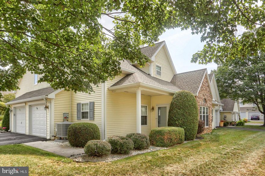 Nestled in the charming Brighton Place community, this exquisite end-of-row condo embodies the perfect blend of comfort and sophistication. Built in 1996, this cottage-style residence offers a warm and inviting atmosphere. Step inside to discover an open floor plan that seamlessly connects the living, dining, and kitchen areas, creating an ideal space for both relaxation and entertaining. The living room is anchored by a cozy propane fireplace, perfect for those chilly evenings. At the same time, large windows bathe the space in natural light, accentuating the rich textures of the luxury vinyl plank flooring on the first floor and the carpeting on the upper level.  The convenient kitchen is equipped with a built-in range, sleek dishwasher, and a convenient microwave. The refrigerator, electric dryer and washer are also included, ensuring that you have everything you need at your fingertips. Retreat to the 1st floor comfy primary suite, featuring an entry-level bedroom that offers both privacy and convenience. The en-suite bathroom boasts a jetted tub providing a spa-like experience right at home.  The upper-level guest room is spacious, similar to the upper-level loft, and you or your guests can enjoy the beautifully finished walk-in shower in the second full bath. Additional interior features include ceiling fans for optimal comfort and stylish window treatments that enhance the home's aesthetic. Outside, the property is complemented by a sunshade to make the entrance porch comfortable in the western sun, and a level lot, perfect for outdoor activities or simply enjoying the fresh air. The side-entry garage provides ample parking space, while the paved driveway adds to the home's curb appeal. This residence is not just a home; it's a lifestyle. With its blend of luxury and comfort, it offers a unique opportunity to enjoy the best of suburban living while being just moments away from local amenities.  Since the owners feel the need to move closer to family, now you can experience the warmth and elegance of this Brighton Place gem, where every detail has been carefully curated to create a welcoming sanctuary.