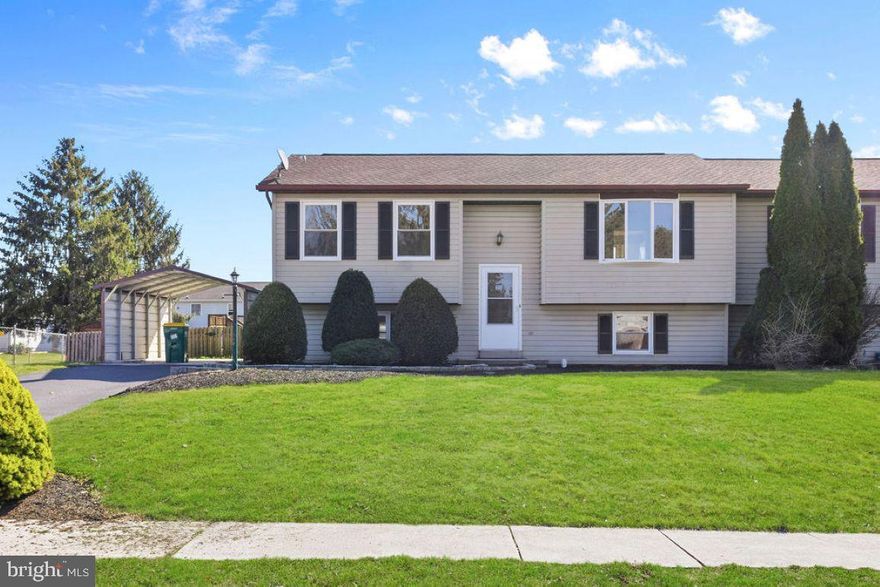 This home is move-in ready and loaded with fresh upgrades throughout to offer a never lived in feel.  Come and check out what this 1,788 sq ft bi-level duplex has to offer.  There are 3 bedrooms and 2 full baths and 3 additional living room options to fit your needs. There is also a room for storage with loads of shelving as well as attic storage. The new renovations include a gutted full bathroom, flooring upgraded in 5 rooms to a gorgeous Dusk Cherry Lifetime 22mil Luxury Laminate, freshly painted walls, ceilings and trim, new stove/range/hood with 5 burners, new kitchen granite counter tops with bullnose edge, new oversized sink for large pots and pans, new high-end faucets and hardware, freshly painted solid wood cabinets, professionally cleaned HVAC ductwork, new central AC unit, all new light fixtures, 4 new ceiling fans with lights, and more.  Updated Wi-Fi-thermostat to control house temperature remotely.  There is a Trex deck off the kitchen with a new sliding glass door and a large rear yard.  Including the carport there are 3-off street parking spots plus on street parking. Freshly painted shutters to match the front door.  Lovely walking neighborhood, close to schools and shopping.  This is a great place to call home or for an investor!  The rent before renovations was $1,850 a month.