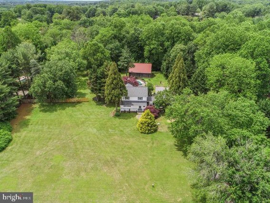 Private 2.2 acres - Upper Seneca Crest Neighborhood (Gaithersburg/ Damascus)!

Don't miss this rare opportunity to own a piece of paradise.
This 3- bedroom, 2.5- bathroom home backs to woodlands and Seneca Creek offering exceptional privacy and natural beauty. Step inside to a spacious, open concept kitchen with quartz countertops, soft- close cabinetry, and luxury vinyl plank flooring throughout most of the home. The expansive great room, surrounded by windows, features a stone hearth, built- in bench seating, and serene views of the surrounding woods. The walkout basement offers generous space and unlimited potential to customize as you wish. 

Key system updates include:
- HVAC (2018)
- Roof (2021)
- Septic Baffle (2023)
- Well Pump (2024)
- Well Tank (2025)
The home also features a complete electrical heavy- up and transfer panel, providing a backup power source. 
The oversized, insulated two- car garage includes built- in cabinetry and a wood- burning stove - perfect for a workshop or hobby space. A freshly painted breezeway with a swinging bench and ceiling fan leads to a welcoming front porch.

Outdoor features:
- Large in- ground pool with spa jets, built- in seating, custom covers, and removable safety fence
- Outdoor shower
- Storage shed
- Custom Amish- Built 2 story barn (2,400 sq. ft.) with concrete floor and electricity

This one- of- a- kind property offers endless possibilities whether you're seeking a peaceful retreat, hobby farm, or entertainer's paradise.