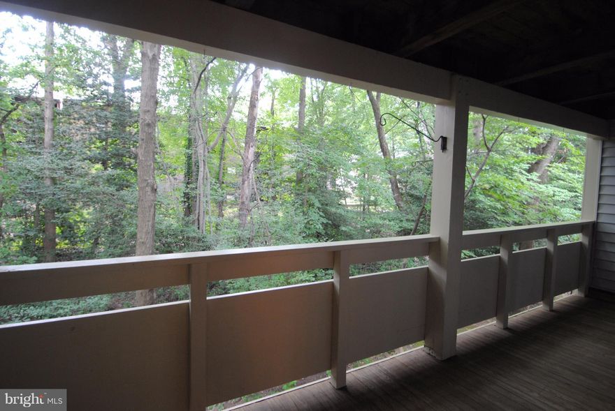 New refrigerator. Large deck back to trees. Two master Suites. Very clean. New Wash and New drier in unit.  Fireplace doesn't work.  The photos are old - no vinuyl floors anymore.  All Carpet!