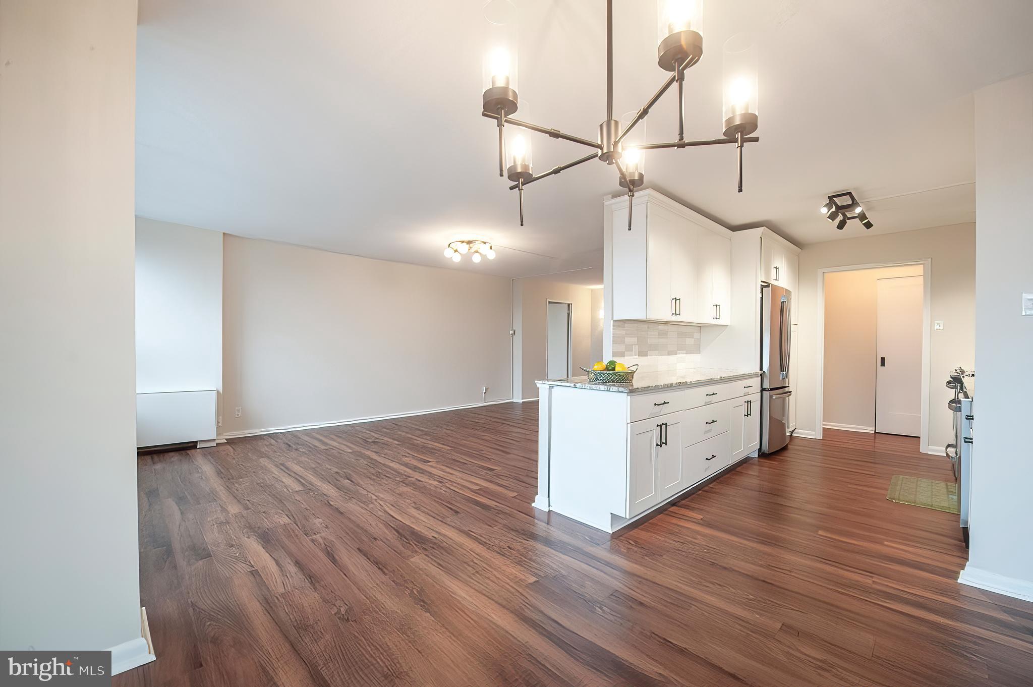 The owners have thoughtfully renovated this 10th-floor home with quality and style throughout. Ideally located just steps from the main elevators, this unit offers peaceful views of the surrounding woods, creating a sense of privacy and calm. Inside, you’ll find luxury vinyl tile flooring in the living room, kitchen, and second bedroom, along with brand-new carpet in the primary suite. All-new shaker-style interior doors, updated lighting, upgraded electric service, and an in-unit electric washer and dryer add both comfort and convenience.
The beautifully remodeled kitchen features stainless steel appliances, granite countertops, shaker cabinetry, and a tile backsplash. The bathrooms have been tastefully updated with new vanities, sinks, toilets, hardware, and fixtures. Storage is a standout feature, with multiple custom closet systems designed for maximum organization. An assigned deeded parking spot is also included.
Set in The Green Hill, a full-service, gated community in the award-winning Lower Merion School District, residents enjoy 24/7 doorman service, indoor and outdoor pools, a fitness center, walking trails, tennis courts, a playground, social rooms with planned activities, shuttle service, and ample guest parking. The HOA fee includes all utilities. Special Assessment $340.42 payable in June, July and August but confirm the duration with the condo. As an added bonus, the assessed value has been lowered, resulting in reduced property taxes.
Conveniently located near public transportation, shopping, dining, and Center City Philadelphia—this home blends modern living with natural surroundings and unmatched convenience.