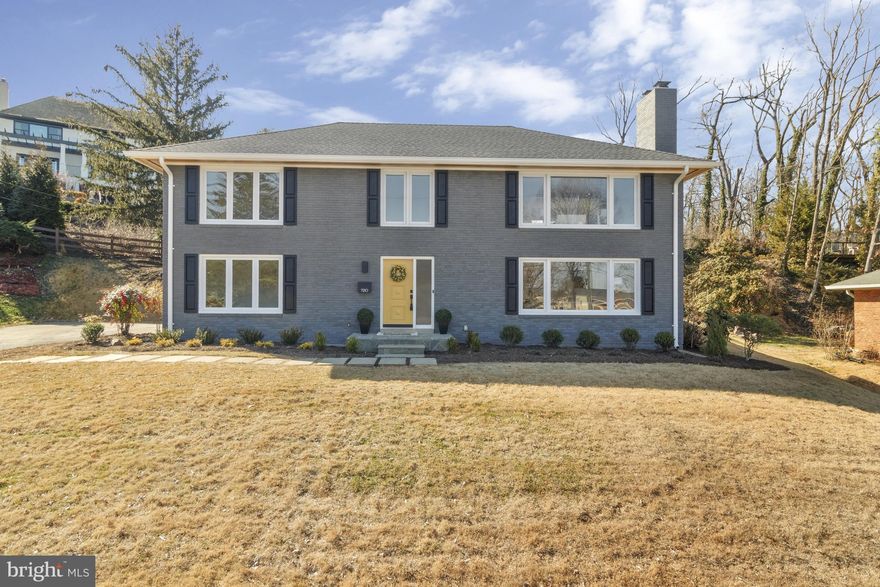 Marvelous Mid-Century in Ever-Popular Villamay! Open-concept show-stopper offers stunning river vistas, and stylish updates throughout. Unique bi-level layout maximizes this home's bird's-eye view of some of Washington's most iconic landmarks.  Modern two-tone kitchen boasts massive island, custom European-style cabinets, open shelving, quartz counters, pantry cabinet, under cabinet lighting, and more. Carefully curated finishes throughout, including all-new baths, custom railings, cedar soffits, and hardwood floors. Luxurious owner's suite offers two closets, and stunning expanded bath with floating double vanity and frameless glass shower door.  Two fireplaces, massive family room, and entry-level bedroom with full bath. All-brick exterior with generous yard and sunny patio. Two car garage. Owner/Agent.