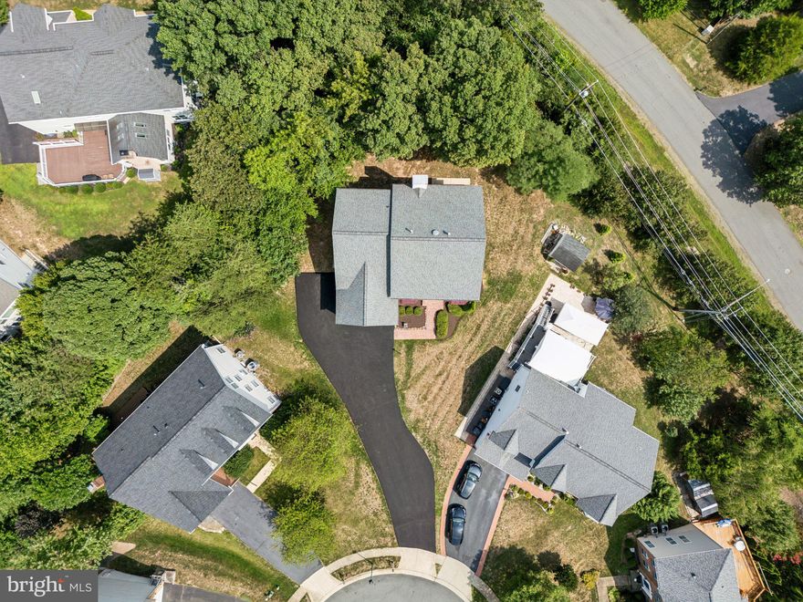 The perfect opportunity to own a freshly painted, well maintained, Crane Homes, Modified Oxford Builder’s Model. Rear, beautiful, 6 bedrooms, 4.5 bathrooms colonial custom-built Single-Family home features 2 spacious Primary Bedroom suites (Main and Upper floors), Upgrade Colonial Trims, with an estimated total finished grade of 5,808  sq. ft, (Below Ground: 1154 sq. ft, Main Floor 2: 1771 sq. ft, Upper Floor 3: 1729 sq. ft) on 0.393 acres (17,107Sq. Ft) of land, quiet cul-de-sac, private backyard, close to everything, highly-rated schools and located in beautiful CLIFTON PINES.

The home's main floor features gleaming hardwood floors, Nine (9) Foot Ceilings, and plenty of natural light throughout the main floor. The main floor level features a rear-to-find Primary Bedroom suite complete with a spacious closet, bathroom with a soaking tub, a private toilet, double sink vanity, and a separate roomy standing shower. 
Large 2-story family room with Palladian window, fireplace with mantle and TV nook, 5.1 Media speaker system. A separate living room with a bay window includes window treatment hardware (in the garage) and a dining room with a bay window also provides window treatment hardware (in the garage). Gourmet kitchen with new appliances - Double Oven/Microwave, Granite countertops, maple cabinetry, eat-in kitchen complete with a large island and breakfast area with bay window, pantry, and first-floor visitor’s half bath. 
The Laundry features ceramic flooring, a washer and dryer pair, and overhead cabinets and shelving, which leads into a spacious two-car leads into two-car garage and a newly paved driveway with 5+ additional parking spaces
The upper floor Primary Bedroom suite includes a huge walk-in full bathroom with a large soaking jacuzzi jet tub, a separate roomy standing shower, a private toilet, a double sink vanity, a huge walk-in closet over the 2-car garage, and a 5.1 Media speaker system ready for your large smart TV.
The full-floor finished basement features a large bedroom, full bath, large walk-out den/office/gym, a large game room/entertainment center with a 5.1 Media speaker system ready for your large smart TV or large screen, and a projector with abundant utility room/storage space.  
Step outside to the expansive backyard with wooded views. Large storage shed capable of housing a full-size tractor. The large front yard features a brick stoop, walkway, and newly paved driveway. 
 Whole house water filter. The  HVAC system was installed in 2019 with rear AIR SCRUBBER PLUS, FURNACE DEHUMIDIFIER, AND HUMIDIFIER