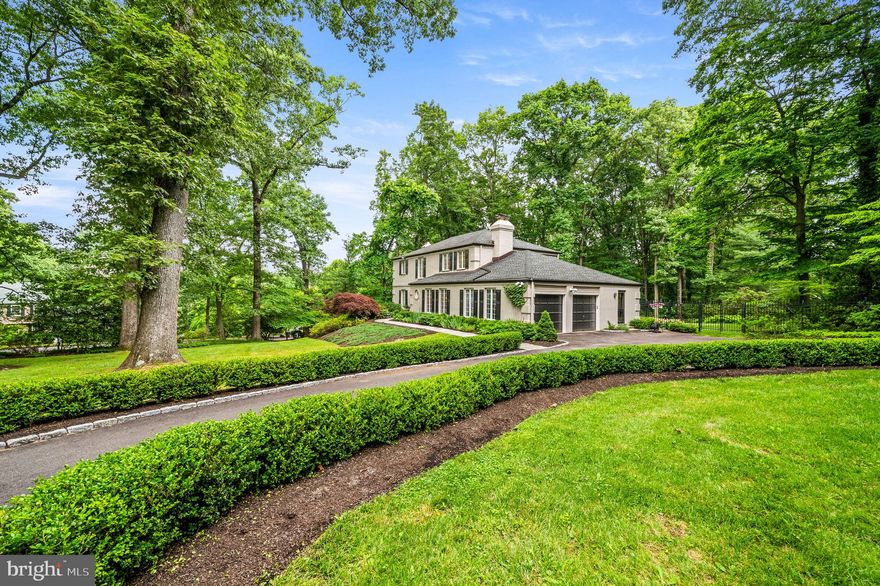 Showings begin Thursday, June 13. Stunning, impeccably-maintained residence nestled in a highly sought-after neighborhood, boasting a picturesque exterior and beautiful grounds. The elegant entrance welcomes you into a two-story foyer, exuding an air of sophistication. Natural light floods the interior through expansive windows, accentuating the beauty of the hardwood floors and intricate millwork. Entertain guests in the refined living room featuring panoramic views and a gas fireplace with slate surround and handsome mantel. The formal dining room, adorned with a brick accent wall and wood-burning fireplace, is perfect for hosting intimate gatherings. Alternatively, it can be repurposed as a versatile great room, as the previous owner did. The gourmet kitchen is a chef's dream, equipped with premium inset cabinetry, soapstone counters, and top-of-the-line Thermador appliances. A spacious pantry, open shelves, and hutch with glass doors provide further storage and interest. The delightful breakfast room enjoys a view of the gorgeous backyard and opens to an expansive Trex deck, perfect for al fresco dining. Enjoy your morning coffee or unwind at the end of the day as you take in the lush, backyard oasis, offering a spectacular show of blooming shrubs and perennials throughout the spring, summer, and fall, all protected by deer fence. Adjacent to the breakfast room is a cozy family room, with built-in bookcases, TV cabinet, and a beautiful view of the backyard. An updated powder room and large laundry/mud room with abundant storage complete the first floor. The hardwood floors continue on the stairs and throughout the 2nd floor, with hardwood under the bedroom carpets. Retreat to the serene primary suite with custom closets and a luxurious, renovated ensuite bath with double vanities. Two generously sized, bright guest bedrooms share a beautifully updated marble bath. The finished basement provides additional flexible living space, walk-in closets, and a walk-out to the backyard. A large unfinished area provides additional storage space. Added features include a whole-house generator and a deer fence to protect the spectacular yard. Conveniently located near major highways, shopping, and dining, this home offers the perfect blend of elegance and functionality. Don’t miss the opportunity to make it your own!