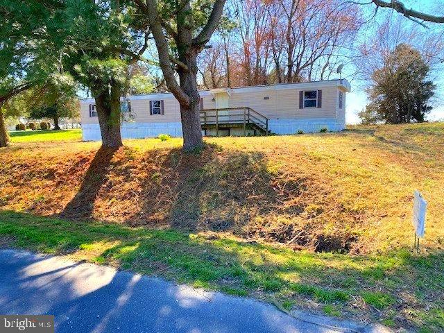 Significant price reduction. Value is in the land. 3 bedroom 1.5 bath manufactured home is situated on a level and largely cleared half acre lot with beautiful views of nearby farmland. Convenient to Chestertown and nearby water access. This home has been vacant over two years so zoning will require at minimum a fire suppressant system and permanent foundation for occupancy. Will also require a new well. Property sold strictly as-is. Sale includes land and manufactured home or home could be sold separately. Note that the tax record has the address as Lynch, MD 21646 but google recognizes as Worton, MD 21678.