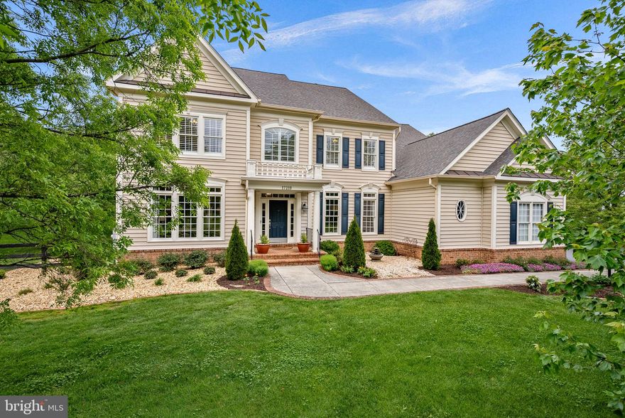 Live Grand. Live Comfortable. Live Here.

Welcome to 17219 Westfield Place in the sought-after Broad Oak community of Hamilton—where timeless elegance meets everyday comfort on a beautifully fenced 2.85-acre estate.

This exceptional 5-bedroom, 5 full and 2 half bath residence offers approximately 6,851 square feet of impeccably finished living space, designed for both grand entertaining and relaxed living. From the moment you arrive, the manicured grounds and mature landscaping create a striking first impression, leading to a stately front portico and inviting entry.

Inside, a dramatic two-story foyer showcases a sweeping curved staircase with wrought iron balusters, setting the tone for the refined details found throughout. The main level features soaring 10-foot ceilings, rich hardwood flooring, extensive crown molding and wainscoting, and an abundance of natural light streaming through floor-to-ceiling windows. Thoughtfully designed living spaces include formal living and dining rooms with a butler’s pantry, a private office, and a warm, inviting family room anchored by a stunning floor-to-ceiling stone fireplace.

At the heart of the home, the expansive gourmet kitchen is a chef’s dream—appointed with granite countertops, a large center island with seating, 42” cabinetry with pull-outs and soft close cabinets, under and above cabinet lighting, a walk-in pantry, built-in desk, and premium appliances including a 6-burner gas range, double convection ovens, and more. The adjoining breakfast area opens seamlessly to the family room, creating the perfect gathering space.

Step outside to a quality built, spectacular covered porch with a stained cedar ceiling, ceiling fans, and ample room for dining and lounging—overlooking the fenced backyard and a custom firepit area, ideal for year-round enjoyment.

Whether you're an experienced gardener or just discovering a love for gardening, you’ll appreciate the custom fenced vegetable and flower garden—perfect for summer planting and enjoying a season filled with fresh vegetables and beautiful blooms.

Upstairs, the luxurious owner’s suite is a private retreat featuring a tray ceiling, spa-inspired bath with a soaking tub, separate tiled shower, and dual walk-in closets with custom organizers. Four additional spacious bedrooms include en-suite and shared bath configurations, along with a versatile loft area perfect for a second office or study space.

The fully finished lower level offers even more room to unwind and entertain, complete with 9-foot ceilings, a large recreation area, second family room, oversized mirrored home gym, full bath, and ample storage. A walk-up provides convenient access to the backyard, which also includes a separate fenced raised garden area.

Additional highlights include a 3-car garage, mudroom, large laundry room with custom cabinetry and 1/2 bath, whole-house water softener and purification system, newer heat pump, and a roof replaced in 2019.

Perfectly located within walking distance to the W&OD Trail, and just minutes to shopping, dining, and commuter routes to Northern Virginia, Maryland, and Washington, DC—this extraordinary home offers the ideal blend of luxury, space, and convenience.

A truly exceptional offering—this is one you won’t want to miss.