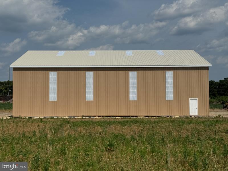 Brand new 4,000 sq ft space on 2 acres of cleared and level land. This building has an estimated completion of on or before September 1, 2025. To be equipped with 2 pedestrian entrances, electric, lighting, concrete floors , large 16' roll up doors on each end , with a large barn style double slider on the east facing side, away from Foskey Lane. Additional acreage can be added for $750/month per acre, up to 10 acres maximum acreage leased.
