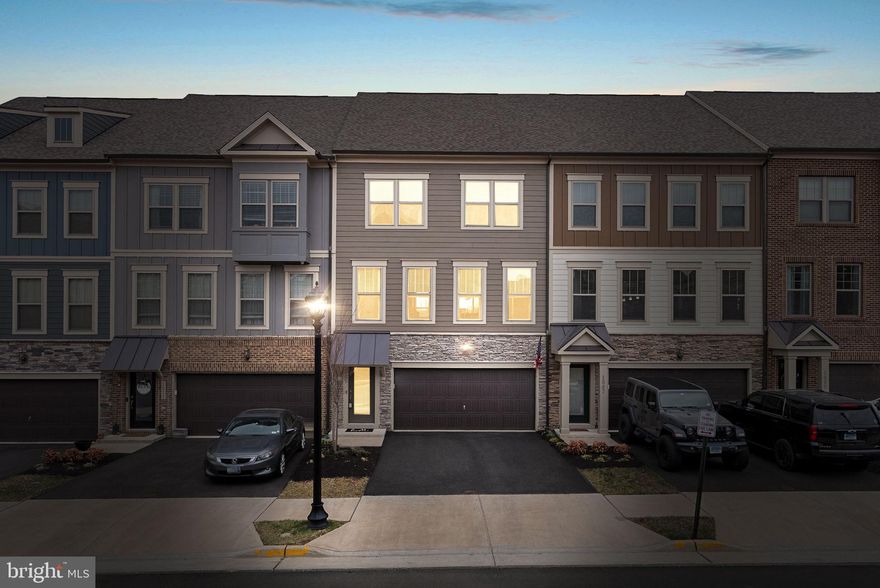 Welcome to your stunning, like-new townhome in Tuscarora Village! 3 bed, 3.5 bath townhome spanning almost 2,500 square feet across three levels will provide you all the space and comfort you'll need! Enter the home through the front door with oak stairs or through your two-car front-load garage. The main-level features luxury vinyl plank flooring on an open-concept floor plan featuring a large dining room, gourmet kitchen with quartz countertops, upgraded stainless steel appliances, a range hood, and pendant lights. The large family room is off the kitchen and boasts natural light. Right off the family room is a deck that backs to a pond - what better than to sip your morning coffee here! The main level also features a half bathroom and a coat closet. Oak stairs lead you to the third level featuring a large primary bedroom with luxury vinyl flooring, large his-and-hers walk-in closets, and a primary bath featuring upgraded tile, quartz-topped dual-vanity sinks, frameless shower glass door with a bench. The laundry room is conveniently located off the primary. Across the hall are your two secondary bedrooms that share a hall bath with a quartz-topped vanity as well. The basement also features luxury vinyl plank flooring and a full-bath! Sliding glass doors lead you to your fully-fenced backyard backing to a pond. The home was just painted throughout. Current amenities include a tot lot, community pool, pickleball court, clubhouse, and direct access to the W&OD Trail. Right off Route 7, this fabulous home is within walking distance of The Villages of Leesburg and its shops, restaurants, and entertainment. Five minutes to Downtown Leesburg, a quick two-minute drive to the Leesburg Outlets and shopping centers, and less than ten minutes to One Loudoun make this location ideal for you!