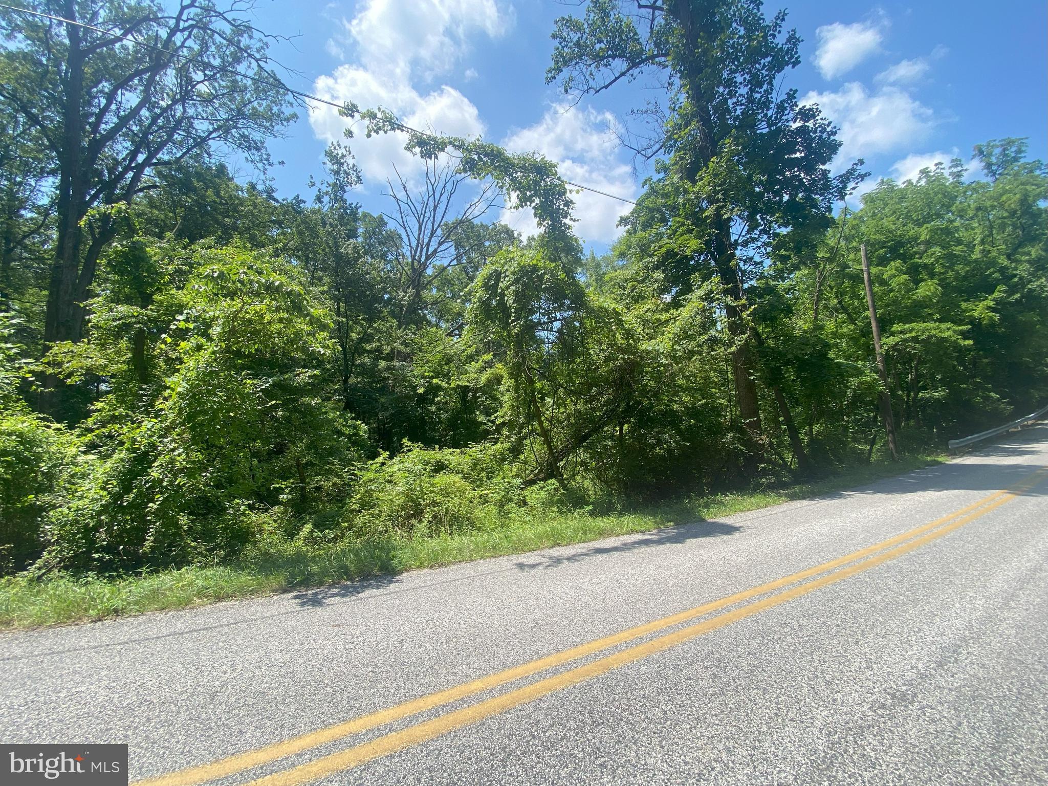 10.43 acre wooded lot along a small country road with a small stream, adjacent to farmland, approved perc site offered (not currently perced), private setting. Approx. 6 miles from York City, RT 83 & RT 30. Great location to build your dream home. Seller is in the process of a new survey. Property is not perked yet, it will be perked after the buyer chooses an approximate building location.