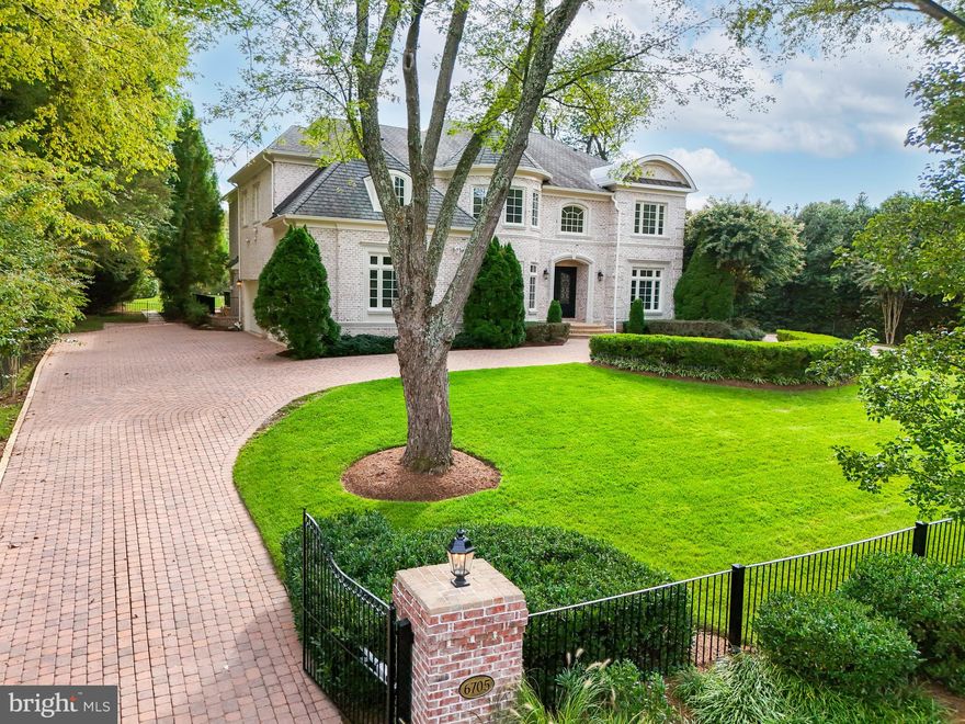 Exquisite Custom Estate in Langley Forest with the most Magnificent Backyard in the neighborhood!
This breathtaking estate on 1.15 acres with meticulous landscaping has a stunning pool area and unparalleled vistas. The fully fenced property is accessed by a gracious circular driveway, leading to a 4-car Garage and inviting terraces.
Upon entering the elegant two-story Foyer, you’ll be captivated by soaring ceilings, oversized windows, rich hardwood floors, and custom millwork that exude refinement. The Main Level encompasses a formal Living & Dining Room, a well-appointed Office with built-ins, a Sun Room offering pool views, and a Gourmet Kitchen featuring custom cabinetry, a generous island with bar seating, and an adjacent sun-drenched Breakfast Room that flows into the cozy Family Room with a fireplace.
The Upper Level is a sanctuary in itself, featuring the Owner’s Suite with a double-sided fireplace, dual walk-in closets, and a spa-like bath. Additionally, there are three more en suite Bedrooms, a convenient Laundry Room, and a Cedar Closet on this level.
The Lower Level is an entertainer’s dream with a Recreation Room boasting a fireplace, a Wet Bar, Wine Cellar, Fitness Room, and a Bedroom with a full Bath. This property epitomizes luxury living.