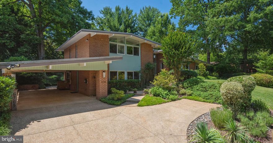 This impressive mid-century modern home with an expansive (over 1/3 acre) beautifully landscaped property sits on a serene street at the high point of the desirable Bannockburn neighborhood. The bright and spacious interior highlights abundant windows, gleaming hardwood floors, and quintessential mid-century modern details. The expansive custom chef’s kitchen opens to a large, welcoming living room with a fireplace and walls of floor-to-ceiling windows and sliding glass doors that open to a large brick patio and private yard with flowering bushes and trees. A sun-filled dining/sitting room just off the kitchen is perfect for entertaining. An office and contemporary half bath rounds out the main level. Upstairs are three bedrooms, including a spacious primary bedroom with ensuite bath and balcony. The lower level features an oversized party/recreation room with built-in bar, bedroom, a full bathroom with a sauna and jacuzzi tub, additional kitchen with original mid-century modern features, den/media room, and plentiful storage. This inside-the-beltway home is just minutes from downtown Bethesda, 495, 270, and the Metro, with easy access to D. C. work and city life via Massachusetts Avenue, River Road, and the Clara Barton Parkway. Bannockburn is a highly desired neighborhood in the Walt Whitman school district, known for its active community, family and social events, two swim clubs, clubhouse, cooperative nursery school, county representation, and proximity to the C & O Canal and Potomac River.

Please note that appliances convey AS IS. Square footage is larger than tax assessment.