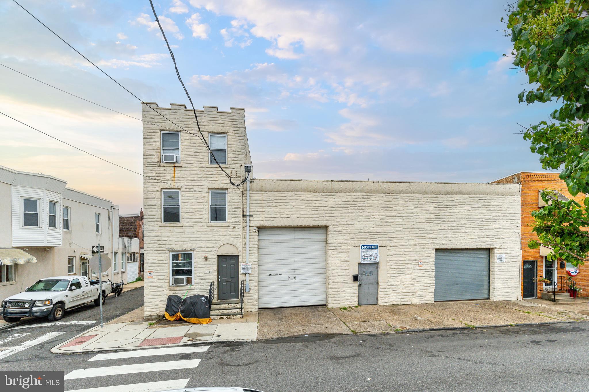 3011-17 Edgemont Street is a prime, corner mixed-use building for sale in the Port Richmond section of Philadelphia, Pennsylvania. Sited on an expansive ±7300 SF street-to-street lot, the building features a large garage space with a pit for mechanics (front and rear curb entry) and three spacious residential studio apartments; One studio is newly vacant (ideal for owner occupant). Current rent roll is $5750. Walkable to beloved amenities like Tacconelli’s Pizza and all the shops, restaurants, bars, cafes and parks in Fishtown and Port Richmond. Easy access into both Downtown Philly and New Jersey. Directly across from a community playground with CMX2 zoning, this property can accommodate a “by right” renovation with additional density for apartments up to 3 storeys. SF and taxes estimated – buyer to verify in DD.