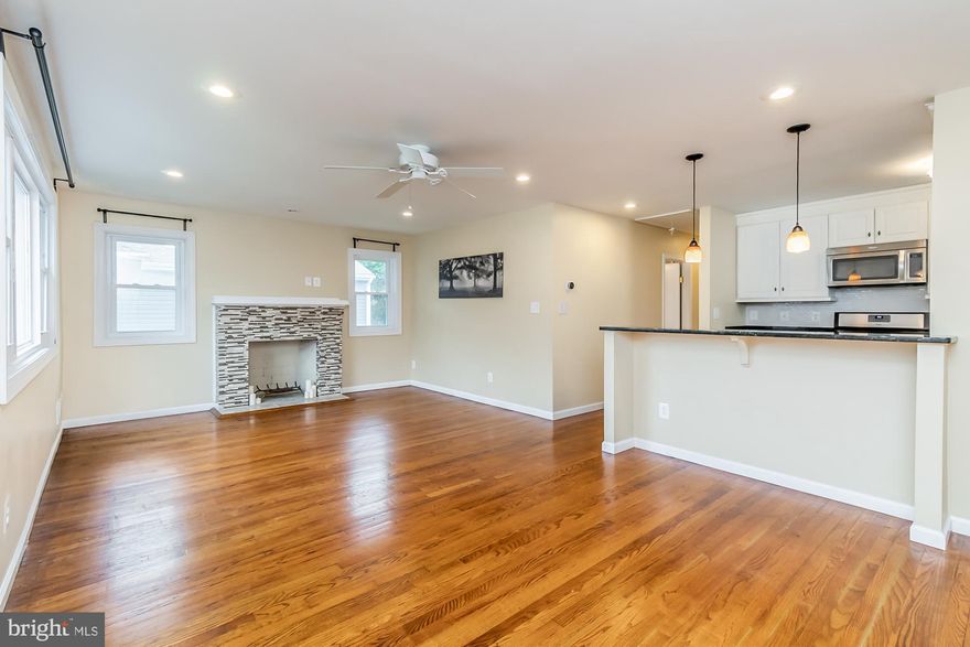 Beautiful Fully Renovated Cape Cod Located on a  Quiet One Way Street! Open Floor Plan with Hardwood Throughout the First Floor. Kitchen Opens to Large Living Room with Wood Burning Fireplace, Recessed Lighting and Ceiling Fan. Kitchen has Granite Counters, White Cabinets, Stainless Steel Appliances and Breakfast Bar. Two Fully Renovated Baths one the First Floor and the Second in the Lower Level. Huge Rec Room in Lower Level...Perfect for Entertaining! Nice Backyard and Plenty of Room for Parking on Driveway.