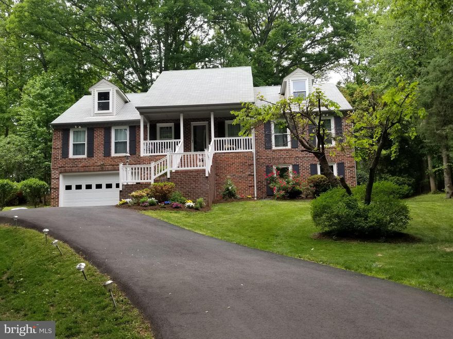 Does your DREAM HOME back to TREES or GOLF COURSE? Then this stunning custom home sited on a gorgeous wooded lot backing to the 4th hole is for you!  Placed perfectly, this magnificent 3800 SF brick front Rambler with daylight Lower Level, masquerades as a Cape Cod with front porch, vinyl rails, beautiful landscaping on a recently paved driveway (2020) leading to the 2 car garage.  This premium lot is SPECTACULAR with a park-like back yard off the rear deck that blends into the adjacent golf course about 100 feet away. Inside you'll find vaulted ceilings, skylights, large windows with fabulous views centered by a striking full height wood burning brick fireplace that together create a tranquil living area to wind down in. The view extends into dining area and kitchen with plenty of cabinets, solid surface counter tops, French door fridge and new dishwasher (on order).  The 2088 SF main level  is more spacious than many colonial style homes and has 3 BR and 2 BA that include the Primary Bedroom Suite. This fabulous Suite has huge sleeping area, 2 wall-in closets, comfortable sitting room/office, recent renovated Bath and optional laundry. Interior was recently painted and coordinating flooring installed making this home move in ready! Daylight Lower Level is wide open offering several windows and dual French Doors which provide easy access for entertainment, play area or future living space ideal for an in-law suite, or apartment as rough-in is in place. Other features include small workshop, BRAND NEW 2021 Heat Pump, and recent water heater.  Aquia Harbour is a gated community offering tons of amenities: Marina, Pools, Stables, Walking Paths, Clubhouse, Playground.  There's EZ access to commuter parking, bus, shopping plus owners headed for Quantico will save time  with a convenient back gate pass