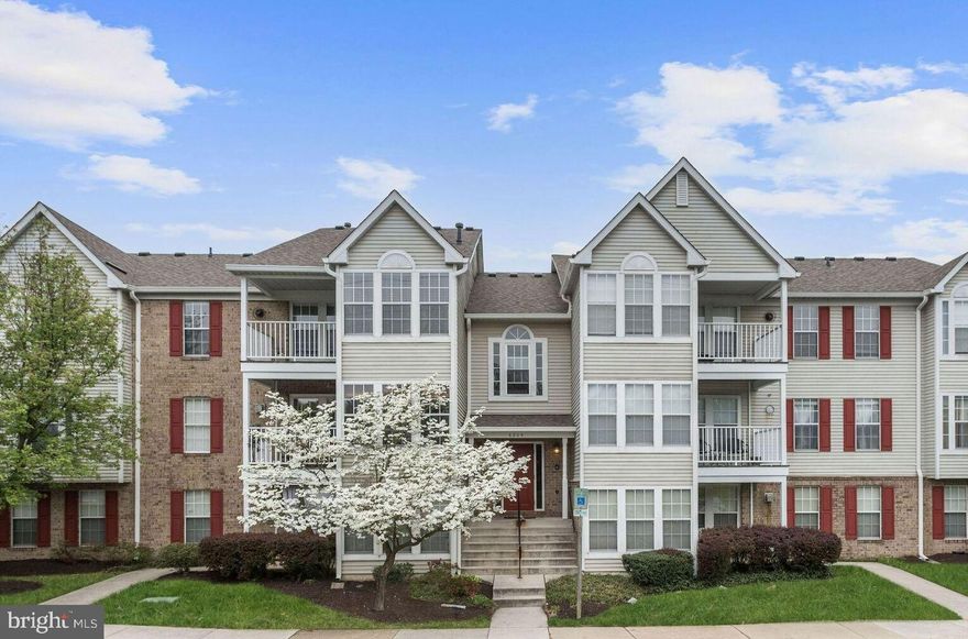 Embrace the bright and airy open floor plan of this inviting residence, where the kitchen seamlessly flows into the kitchen featuring a convenient wall cut out with a breakfast bar adjoining the spacious living room. The kitchen boasts granite countertops and white cabinetry, complemented by stainless steel appliances including a built-in microwave and glass-top electric range.   The sun filled dining room highlights tile flooring and provides access to the patio. This home offers two bedrooms and two full bathrooms, with the primary bedroom highlighting accent molding and an en suite full bath for added comfort and luxury.  Convenience is key with a laundry room located within the unit, providing ease and accessibility. Step outside to the private patio, backing to woods for added privacy and tranquility, creating a serene outdoor retreat. With its thoughtful design and modern amenities, this residence offers a perfect blend of comfort and functionality for effortless living. Welcome to a home where every detail has been carefully considered for your enjoyment.