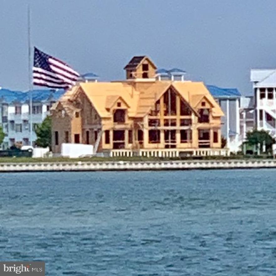 This impressive 6BR/4.5BA home is located in the Estates at Inlet Isle Lane in West Ocean City and has deep water! Enjoy open bay views and endless sunrises and sunsets in this premier location with the famous Ocean City  boardwalk in the background. There is a deep water slip that can accommodate a 42 ft boat providing easy access to the ocean at the inlet. This home is designed and built by David Bradley of Bradley Construction, a respected architectural visionary, having created yet another masterpiece.  The home boasts 4650 sq ft and has an optional bonus room that could be finished to add 2 additional bedrooms and a bath if desired. Once it's gone, it's gone... LOCATION! LOCATION! LOCATION! Imagine that your dream home will be close to world class Marinas, Fishing, Golf Courses, Assateague Island, Ocean City Boardwalk, and Restaurants. Your family and friends are sure to make memories that last a lifetime here. Come take a look at this dream home that has it all including stunning, unmatched architectural style, location and lifestyle! Contracts are being accepted now!  Pick your finishes.