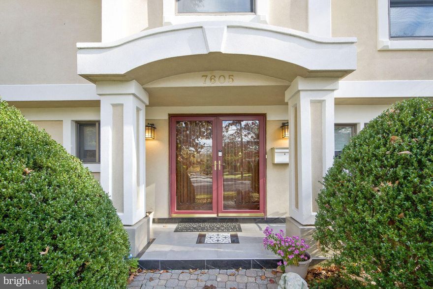 Step into this custom-designed, one-of-a-kind home nestled inside the beltway within the prestigious Whitman School Cluster. As you approach, a beautifully landscaped setting and a wide paved brick driveway, adorned with inset lighting, lead to a detached two-car garage. Upon entering through museum-quality solid mahogany doors, you are welcomed into an open foyer and a spacious multi-purpose room that can serve as a library, office, or bedroom. The same floor also features a separate bedroom suite with an ensuite bath.
Ascend a gracious double-wide staircase to discover a great room boasting a 16 foot ceiling and a gas fireplace set within a stunning granite accent wall. A two-story wall of windows offers a view of the master gardener-maintained back garden, complete with an irrigation system. This space is enhanced by high ceilings and two contemporary ceiling fans. The dining room connects to the sunroom through two sets of sliding doors and leads to the recently renovated kitchen. The well-lit eat-in kitchen is equipped with contemporary cabinets, quartz countertops, under cabinet lighting, a beverage refrigerator, a state-of-the-art smart refrigerator, Thermador cooktop, wall oven and microwave, dual drawer dishwasher, granite backsplash, and porcelain floors. There is a desk area with built-ins and USB port. A wall of windows overlooks the backyard. In the living room, a retractable remote-controlled flat screen television adds a modern touch, with windows offering views of the backyard and a beautifully designed paved outdoor entertaining area. The sunroom provides access to the rear garden a master gardener's and bird watcher's delight including a water feature and numerous perennials and native plants along a paved pathway, as well as the outdoor entertainment area. Additionally, it offers convenient access to the detached garage featuring storage space and an EV charger. Ascend the curved staircase to the large sun-filled primary bedroom, featuring a high ceiling, seating area, and a recently renovated primary bath with a separate tub, state-of-the-art shower, two separate vanities, a smart one-piece toilet, and a prepped linen closet for a washer/dryer combo. Another bedroom suite with a private bath is also located on this level, providing ample space and privacy. The bedroom level is finished with pre-finished maple and mahogany Brazilian wood floors.The lower level, accessed from the first floor, serves as a multi-functional space with a recreation room, laundry, machine room, and storage area. This space is brightly lit with glass block walls and provides access to the garden with a well-lit service area. The home is equipped with recently installed Carrier air conditioning and gas heating in two zones, along with recently installed roofing. The exterior is finished with concrete stucco, and the separate 2-car garage structure is fitted with cabinets and an epoxy painted floor.  This meticulously designed home seamlessly blends contemporary style, natural light, and functional living spaces, making it a truly exceptional residence. Don't miss the opportunity to make this remarkable property your own.