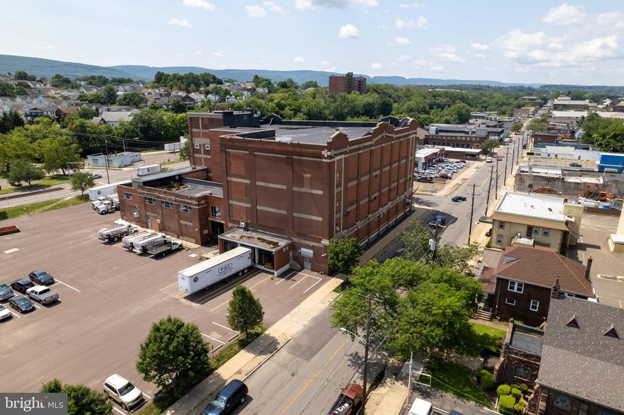 3 commercial acres with a landmark 4-Story, 90,000SF building and 152 parking spaces. Currently housing 1st class warehouse space, office space and production studio. The possibilities are endless for commercial operation, indoor climate controlled storage, expansion or residential opportunities. Warehouse ceiling 14'-20' high, office ceiling 9'-14'.