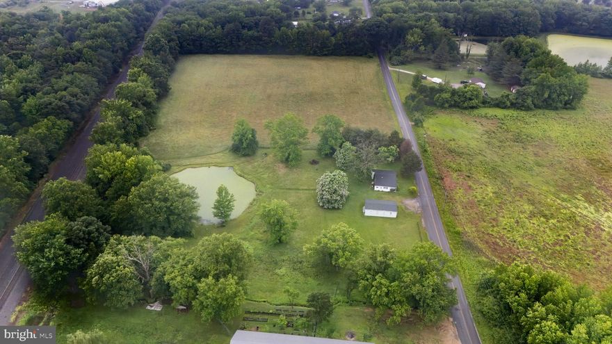 Bring your dream to this beautiful setting of 10 acres with a pond and only minutes from Fair Hill International. Natural spring near the pond. 3 car garage with work space approximately 24x30. Dwelling will need a demo and current septic will not convey to the new owner. Buyer to verify information through Cecil County. Current farm lease exists on property until Fall 2025. Dont miss this opportunity!
