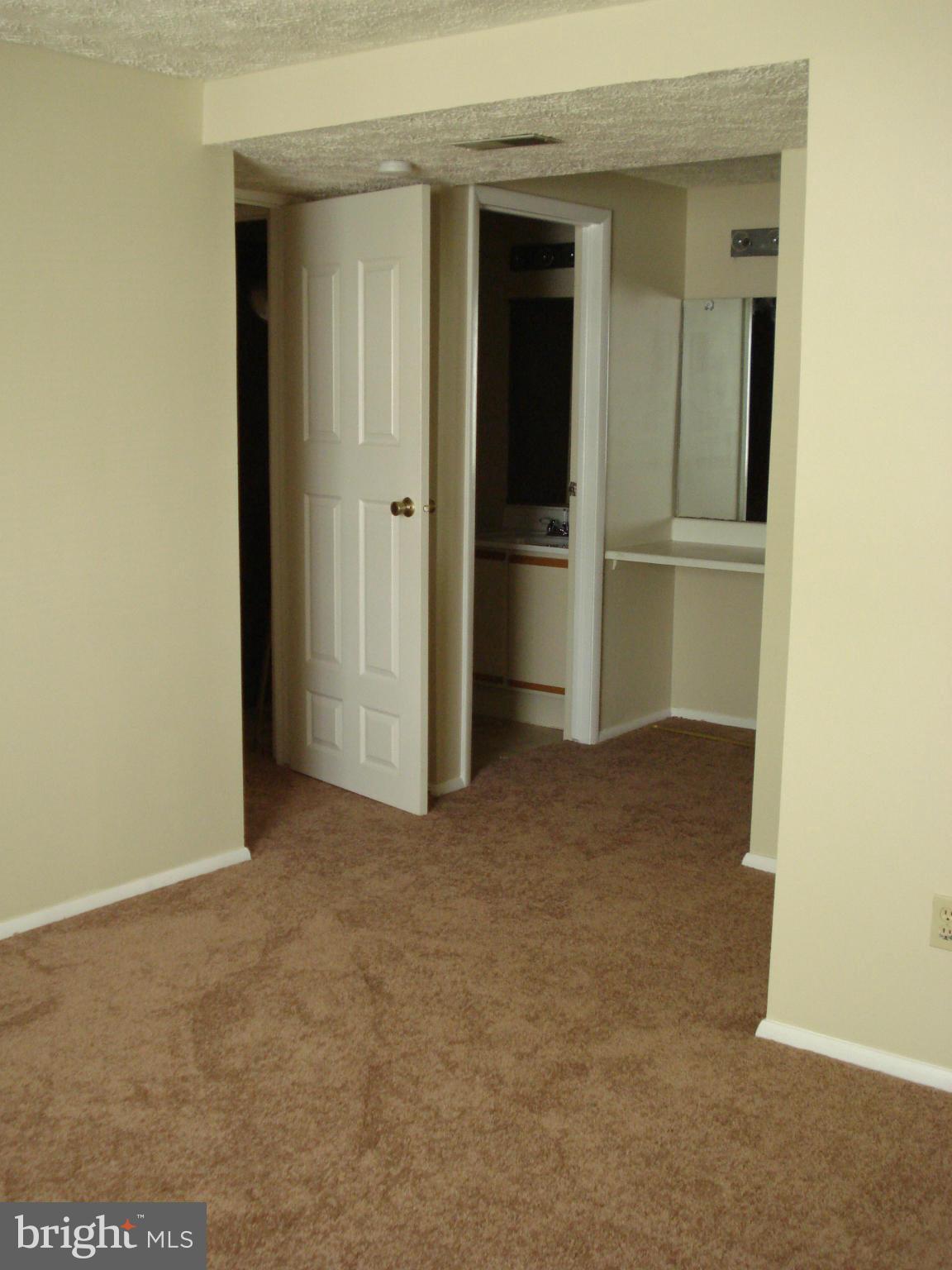 Sunny second floor unit has neutral colors and nearly new wall to wall carpeting, updated bath floor and vanity installed. Open layout, semi private bath. Spacious master bedroom with HUGE walk in closet. Deck off of Living Room. Ample storage, all appliances, full sized washer dryer in separage laundry room; community play ground. Please! no smokers or pets.
