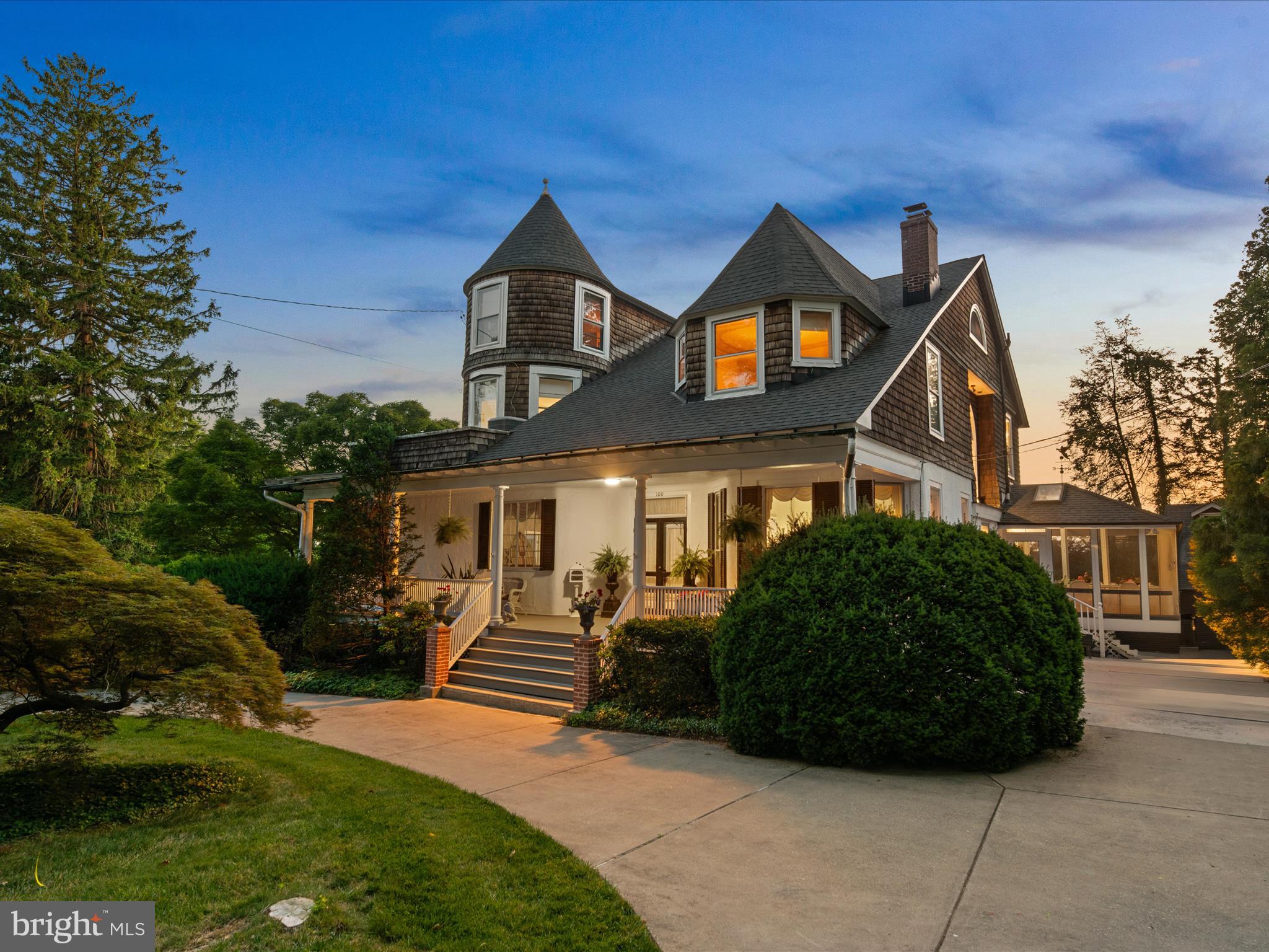Absolutely stunning Catonsville Victorian home brimming with historic charm and distinctive architectural details. Featuring steep gabled roofs, turrets, and a grand front porch, this four-level residence makes an unforgettable first impression. Inside, the elegant center foyer welcomes you with crystal chandeliers, soaring ceilings, intricate wallpaper, and rich hardwood floors.
Spacious formal living and dining rooms offer ideal settings for entertaining, complemented by large casement windows, tray ceilings, and wood-burning fireplaces that add warmth and character. A private office and adjoining library with pocket doors provide the perfect retreat for quiet study, while a bonus niche space awaits your personal touch ideal for a play room or reading nook. The main-level powder room reflects timeless Victorian style with a ceramic sink and ornate fixtures.
The eat-in kitchen features custom glass-front cabinetry, granite countertops, ample storage, and direct access to a serene screened-in porch perfect for morning coffee or evening gatherings.
Upstairs, the second floor hosts three spacious bedrooms, including a spectacular bedroom set in the turret, complete with a private balcony overlooking sculpted gardens and a New Orleans-imported fountain. Additional features include a luxurious walk-in closet, a beautifully renovated en-suite with walk-in shower, a spa-style bath with jetted tub and towel warmer, and a convenient laundry room.
The third-floor offers flexible family room alongside two additional bedrooms full of natural light. The large unfinished basement includes a workshop area, utilities, and generous storage space.
Outside, the meticulously landscaped gardens and private brick patios offer an oasis of calm with mature trees, fragrant blooms, and multiple seating areas. A majestic fountain adds elegance and tranquility, while a charming shed modeled after the original carriage house and equipped with electricity provides versatile use for a studio, workshop, or garden tools. Additional highlights include an in-ground sprinkler system, garden trellis, and lush hedging that enhances privacy.