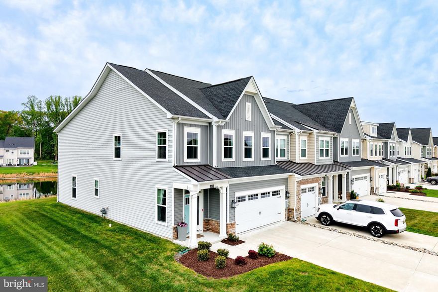 LUXURY POND FRONT SERENITY! Nestled pond-front in the amenity-rich community of Villas at Walden, this stunning 4-bedroom, 3.5-bathroom end-unit townhome offers the perfect blend of coastal sophistication and modern convenience. The light-filled, open-concept main level is anchored by a chef-inspired kitchen, complete with upgraded quartz countertops, premium stainless steel appliances, and a large central island that flows seamlessly into the soaring vaulted ceiling great room. Enjoy the luxury of first-floor living in the spacious primary suite, featuring a private en-suite bath with a dual-sink vanity and a custom-tiled walk-in shower.

The second level is designed for maximum versatility, boasting three additional oversized bedrooms, each featuring its own generously sized walk-in closet, along with 2 full baths, with one being an ensuite. An expansive upstairs loft overlooks the living area, providing an ideal space for a home office, media room, or guest retreat. Outdoor living is a dream in the private screened-in porch, where you can relax to the peaceful sounds of the pond and views of the surrounding treeline. Located just minutes from Delaware’s premier beaches and tax-free shopping, this home offers an unparalleled lifestyle in a community that includes a private kayak launch on Burton's pond, 2 outdoor pools, sports courts, and more! Call and schedule a showing today!