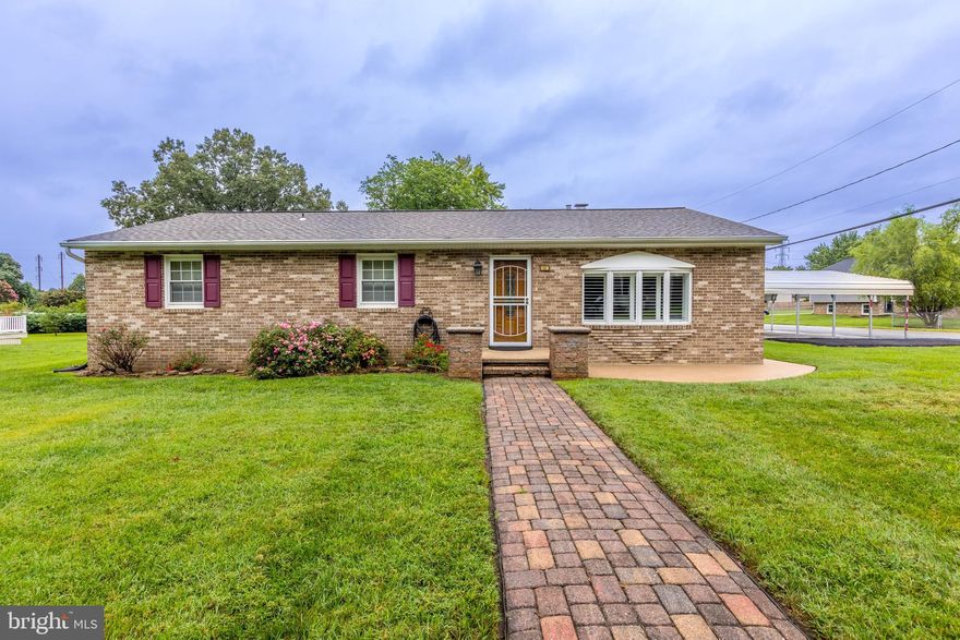 WELCOME HOME TO 525 PATUXENT AVE*This charming 3-bedroom, 2-bath, 100% all brick rancher is situated on a spacious corner lot in the heart of Rosedale*Featuring great curb appeal and solid construction, this well-maintained home offers comfortable one-level living in an established neighborhood setting*Featuring over 1,500 square feet of living space, this home offers a spacious family room highlighted by a beautiful bay window and a striking brick accent wall with a cozy gas fireplace.*The updated country kitchen boasts gas cooking and ample cabinetry, perfect for everyday meals and entertaining.*The primary bedroom includes its own private bath, while two additional bedrooms share a beautifully remodeled hall bathroom*Enjoy a variety of outdoor amenities including a tranquil fish pond, patio, deck, and 2 storage sheds—perfect for hobbies or extra storage*The spacious covered carport accommodates up to 3 vehicles, with 2 additional parking spaces ideal for your extra car, trailer, or boat*Recent updates include the roof, HVAC system, kitchen, flooring, and remodeled hall bathroom*This home is competitively priced and move-in ready—just waiting for its new owners to make it their own!