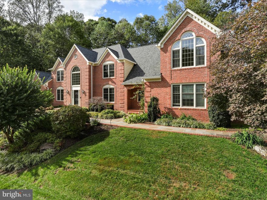 Refined Colonial in Fairfax Station – A Serene Hideaway with Premium Upgrades

Tucked into the exclusive Fairview Woods community, this beautifully maintained Colonial sits on a private, wooded 0.84-acre lot. Featuring five bedrooms, four and a half baths, and a three-car garage, the home offers a perfect blend of timeless charm and modern convenience—ideal for those who value both space and seclusion.

Step into the welcoming main level where gleaming hardwood floors span the first floor. The layout includes formal living and dining rooms designed for both intimate and large gatherings. A light-filled conservatory/sunroom, now enhanced with brand-new hardwood flooring, provides flexible space for reading, yoga, music, or afternoon tea. The chef’s kitchen features stainless steel appliances, granite countertops, custom cabinetry, and a newly installed cooktop (October 2025). A butler’s pantry, walk-in pantry, and breakfast area add to the kitchen’s functionality. The adjacent mudroom with laundry and a secondary entrance connects directly to the three-car garage. The kitchen flows into a dramatic two-story family room with a fireplace, Palladian windows, and access to the expansive Trex deck—perfect for indoor-outdoor living. A freshly remodeled half bath (September 2025) adds style and convenience to the main level.

Upstairs, four spacious bedrooms and three full baths offer privacy and comfort. The impressive primary suite features a vaulted ceiling, dormer windows, fireplace, and three walk-in closets. Its spa-inspired bath includes dual vanities, a soaking tub, separate shower, heated floors, towel warmer, and a private water closet. One secondary bedroom has its own ensuite bath, while two others share a jack-and-jill layout.

The fully finished walkout basement extends the living space with a bedroom, full bath, den, and a large recreation room with fireplace. This level is fully outfitted for entertainment and wellness, featuring a pool table, dedicated theater room complete with theater chairs and a projector, and a fitness alcove equipped with gym equipment. Luxury vinyl plank (LVP) flooring has been installed throughout the entire basement and the 2nd floor for durability and style. Generous storage areas and walkout access to a hardscaped patio complete the space.

Located near the Country Club of Fairfax, the home offers easy access to Fairfax County Parkway, I-66, I-95, and I-495. Commuters will appreciate proximity to the Burke Centre VRE, while outdoor enthusiasts will enjoy nearby Burke Lake Park, the W&OD Trail, and scenic neighborhood paths.

Recent updates include fresh interior paint (July 2025), new cooktop (October 2025), remodeled main floor half bath (September 2025), new hardwood flooring in the sunroom, and LVT throughout the basement. Additional upgrades include triple-zone HVAC system was replaced (Nov 2025) (basement/main, upper level, and conservatory/basement bedroom, with unit replaced in 2022), roof (2021), siding (2021), Trex deck (2021), refrigerator (2022), dishwasher (2024).

This is a rare opportunity to own a move-in-ready home that combines elegance, comfort, and an unbeatable location in one of Northern Virginia’s most sought-after