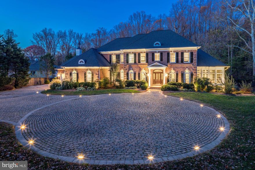 The outstanding features of this exquisite, one of a kind, all brick estate home all begin with its phenomenal location. Situated right  on the border of beautiful Great Falls and McLean, it is located just a half of a mile to Route 7, less than five minutes to Tysons Corner and a short 20 minute drive to DC.  Almost 2.5 beautiful, secluded acres envelop this magnificent home. The gated entry and elegant English inspired paver drive will welcome you to this lavish home with generous sized four car garage. Over $1.8 million dollar in recent enhancements will impress you at every turn. Commercial grade Kitchen designed by a chef will be the focal point when accommodating guests, from intimate gatherings to large events. This seven Bedroom, eight Bathroom home boasts an abundance of luxurious appointments to include four cozy fireplaces, designer Bathrooms, gleaming hardwood floors and a full bar. The lower level of the home provides walk out access to the professionally manicured grounds, tiered Decks, grand pool and Gazebo, which are the perfect spaces for unwinding after a long day or entertaining guests.