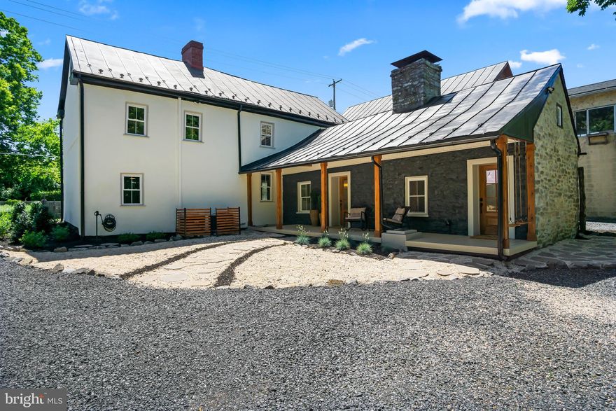 BACK ON THE MARKET Due to NO fault of the seller, buyer financing unfortunately fell through NOW is your chance own This truly stunning historic log and stone home, where timeless charm meets modern luxury.  Originally built in the mid 1700’s, a major restoration was just completed to  thoughtfully blend the beauty of the home’s original features adding artistic modern design and conveniences. Some highlights of this home include a total restoration of nearly 2,500 sq ft of living space including 3 bedrooms with an additional bonus room which could be a possible 4th bedroom, or nursery, or office.  One bedroom is conveniently located on the main level with on-suite.  The Primary bedroom on the second level with a custom sliding barn door is a real hidden gem!  The two fully updated bathrooms include beautiful ceramic tile craftsmanship.  There are all new windows, all new doors, all new flooring with new subflooring.  The kitchen is beautifully designed and features new Kraftmaid cabinets, the upper cabinets with glass front doors, custom in-cabinet and under-cabinet lighting, sleek Calacatta Luisa quartz countertops, Bocchi farmhouse sink, large island with seating area, ceramic backsplash, custom wall hood, and neoclassical antique brass plumbing, with state- of-the-art appliances making the kitchen experience truly a chef’s dream.  The adjacent mudroom/laundry room features an original fireplace with new custom brick hearth, custom shelving, new laundry and trendy farmhouse sink feature.  The dining room features restored wooden beams and an original fireplace with Calacatta Luisa quartz added to the face & hearth.  The log and chinking wall in the living room is original to the home and has been distinctively restored with all of the original character to maintain historic charm.  The two staircases of the home showcase handrails designed and built by a local artisan using wrought iron and red oak railings enhancing the home’s unique aesthetic.  The Side porch has been designed with low maintenance composite decking, painted stone wall with eye-catching board and batten vertical siding, modern lantern lighting and two new exterior doors with 6 large light rain glass windows, and 2 custom brick thresholds.  Two custom-crafted swings are installed for those carefree moments and modern cedar wood posts adorn the kitchen & butler pantry entryways.  More updates include, new dual HVAC system, new electrical system which has been completely upgraded to meet or exceed current national electrical code and new water filtration system by Culligan.  This home is truly a unique and rare find!  Schedule your showing today and experience the perfect harmony of historic elegance and convenient modern living.