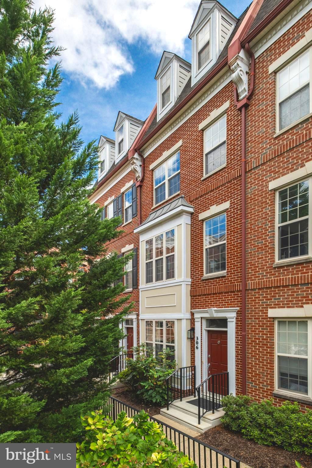 This exquisite 4-story, 3 bedroom + den, 3.5 bath townhome is one of the most sought after models in all of Naval Square! Situated in the front of the community, down a beautiful landscaped pathway you will find the pristine, 306 Governors Court. This expansive 16 ft. wide Nelson model features a private entryway, beautiful bay window on both the 1st and 2nd levels, and a 1-car garage! Spacious rooms, 2 large private terraces, and countless upgrades throughout. Enter the 1st level, and you are welcomed into a lovely den/office space with newer upgraded hardwood flooring and a charming window seat (with added storage). You’ll love having an actual laundry room with newer side-by-side LG washer/dryer & modern built-in cabinetry above. The 2nd level is the heart of the home: featuring a sunny, open concept living/dining space with oak hardwood floors and beautiful bay window looking out upon lush landscaped grounds. The spectacular, kitchen with island, features shaker-style cherry cabinets with stone counters & a tumbled marble tile backsplash. Stainless appliance package includes a Whirlpool refrigerator, newer Bosch dishwasher and newer GE Profile range & microwave. The spacious kitchen opens to a serene terrace, perfect for enjoying your morning coffee. Freshly renovated, powder room is located on this level. 3rd level: elegant owner's suite with dual-closets. The owner's bath is luxurious, featuring dual sinks, a large whirlpool tub and a separate shower. Additional sunlit bedroom w/ private en-suite bath completes the 3rd floor. 4th level: the spacious 3rd bedroom, features its very own private rooftop terrace with skyline views! Enjoy a full bath on this level as well. Plenty of storage in the garage and coat closet on the first level. Neutral paint and fantastic upgraded modern lighting throughout. Take advantage of the outdoor amenities of the 20-acre park-like setting, including picnic areas, well-kept gardens, and mature landscaping. With gated entry and on-site visitor parking, convenience and security are paramount. Located in close proximity to the South Street Bridge, UPenn (0.7 mi), CHOP, HUP, Drexel, Rittenhouse (0.9 mi), and Fitler Square. Fantastic restaurants and cafes—such as Rival Bros Coffee, Friday Saturday Sunday (James Beard Winner), Illata BYOB, Pub & Kitchen, Southgate, Sabrina’s, and Loco Pez—are all just steps outside the gates. The new Heirloom Market by Giant and South Square Market are only a block away. Directly out the back gate, you’ll find easy access to the Schuylkill River Park, including the award-winning trail and boardwalk, Markward Playground, tennis courts, and dog park! Naval Square is a pet-friendly community allowing up to 2 pets with no weight restrictions. Don’t miss this rare opportunity to own a sophisticated, move-in-ready home in one of Philadelphia’s most coveted communities! Seller's preferred settlement is as soon as possible.