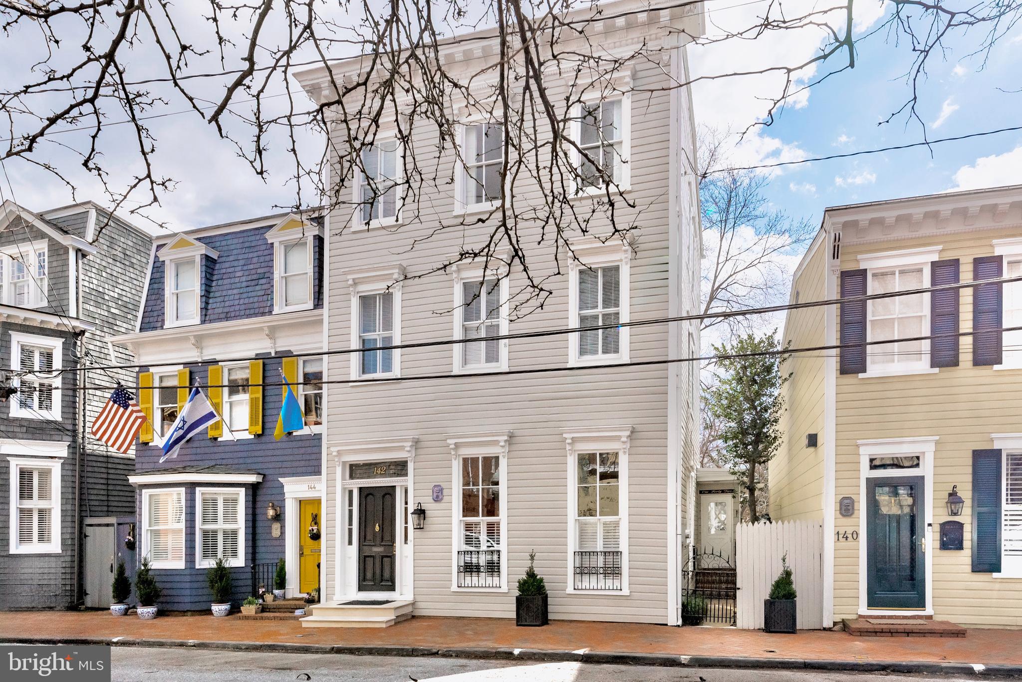 Welcome to this elegantly appointed historic home located on Charles Street in Historic Annapolis. Built sometime between 1880 and 1885 by the Cobbler from the U. S. Naval Academy, this stunning home stands proud as an homage to the Italianate style in which it was built. A few houses in from Duke of Gloucester, this home is centrally located where you can walk to all the shops and eateries with ease but manages to be a quiet spot at the same time. Enter the home through the charming vestibule and center hall boasting tall ceilings and beautiful colonial moldings. Enjoy hosting guests in your spacious contemporary gourmet kitchen featuring a large kitchen island, custom tile backsplash, granite counter tops, stainless appliances and sleek white cabinetry. Several skylights and architectural picture windows offer a tremendous amount of natural lighting. Many of the historical features of the home have been preserved including the hand carved banister with decorative scroll stair brackets and two non-working fireplaces. From the gracious rooms featuring hardwoods throughout the 3.5 finished levels, to the 5 bedrooms and upgraded bathrooms, you will have plenty of space for everyone. The homeowner added a bedroom level laundry for convenience and there is an additional laundry hook up in the basement. You will find ample space for storage in the basement as well. This property is perfect for entertaining from the kitchen that flows nicely into the family room to the private fenced brick courtyard and garden with mature trees. Host your guests for an outdoor dinner party under the stars. Don't want to cook? Main Street is only a block away. Stroll to "Duck Park" at the bottom of the street to gather with neighbors, hop on the water taxi or launch your kayak or paddle board. Live the elegant life of Annapolitans of a bygone era with all the conveniences of the modern world. There is a reason Annapolis is voted one of the top places to live time and again. Come see for yourself!