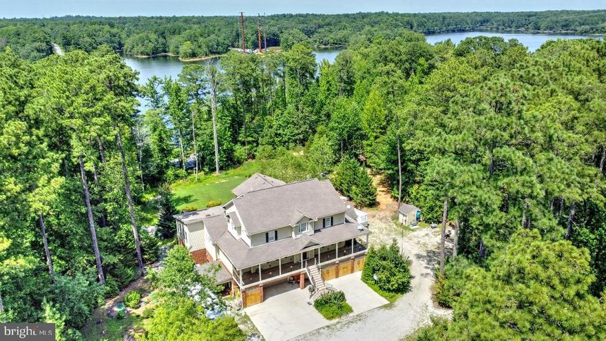 Enjoy sunsets over the Diascund Reservoir from your backyard at your private retreat! Amazing home on 5.6 acres with 6,110 square feet of living space plus four-car garage and elevator to all three levels. The primary suite is 1,600sf plus 300sf EZ Breeze Porch. Two bedrooms share a Jack and Jill bath. Formal living and dining rooms. Kitchen with custom cabinetry, granite, two dishwashers, and island. Additional 300sf EZ Breeze Porch. Large front and rear porches. Too many upgrades to list. Built by local custom home builder for his personal residence