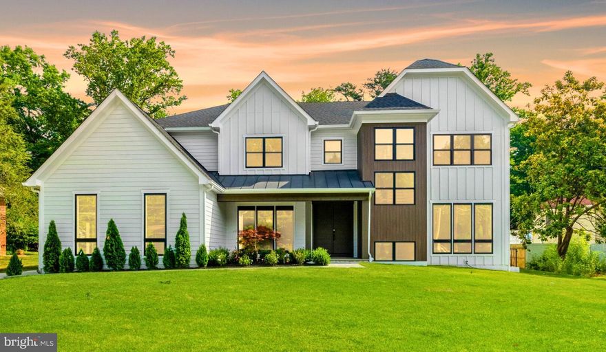 This newly constructed farmhouse in Vienna exemplifies modern design seamlessly intertwined with traditional comforts, creating a living space that is both visually stunning and warmly functional. Set on a spacious flat lot ideal for a pool and pool house, this home is designed for a lifestyle of leisure and elegance.
The home features a balanced open floor plan enriched by traditional elements, fostering an inviting atmosphere that feels both spacious and cozy. The exterior showcases clean lines and sloping panels, projecting modern elegance, while oversized slate blocks lead up to grand French doors.
Inside, simplicity underscores sophistication. The kitchen and family room form the heart of the home, where a gas fireplace warms the family room, illuminated by abundant natural light from surrounding windows. The kitchen is a chef's paradise, boasting polished marble countertops, extensive cabinetry, and professional-grade Bluestar appliances, including an 8-burner gas stovetop and a French refrigerator-freezer. A seamless marble island with a prep sink and contemporary pendant lighting enhances the kitchen's allure, complemented by a convenient adjacent pantry and prep kitchen.
The mudroom features a sleek built-in bench, while the dining room's contrasting painted walls further the contemporary aesthetic. The first floor also includes an ensuite bedroom, an office, and a stylish powder room, all designed for modern living with a nod to traditional comforts.
The second floor is home to the primary owner's suite, a luxurious sanctuary. The bedroom is opulent, featuring a built-in beverage station with a wine cooler, a boxed ceiling, and subtle recessed lighting, creating an atmosphere of refined comfort. The expansive walk-in closet is meticulously organized for optimal space and accessibility. The ensuite bath exudes elegance, showcasing dual vanities with brass fixtures, a princess-style soaking tub, and a separate water closet. The spacious shower features floor-to-ceiling marble, dual rain shower heads, and misting sprays for a spa-like experience.
The laundry room is efficient and well-appointed, with ample built-in storage, generous countertops, and a drop-down ladder for attic access. The second floor also includes three additional ensuite bedrooms, each a private retreat designed for comfort.
The lower level is designed for effortless entertainment, featuring a spacious recreation room suitable for a pool table and various seating arrangements. A sleek wet bar crafted from polished marble, complete with a prep sink and stylish lighting, serves as the centerpiece. Adjacent to this area is a temperature-controlled wine cellar, while a conveniently located gym offers ample space for workouts.
The expansive flat lot is perfect for a pool and pool house, providing an ideal outdoor oasis. Residents can easily walk or bike to Vienna’s trails and parks, with the Vienna Community Center and the town's vibrant amenities just a stone's throw away.
This contemporary farmhouse is not just a home; it’s a lifestyle, combining modern luxury with the warmth of traditional living in a prime Vienna location.