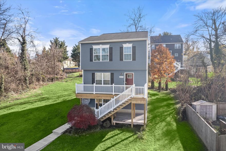 Welcome to the Patapsco Park community of Anne Arundel County. This inviting vinyl-sided Colonial opens into a main level adorned with beautiful hardwood floors and rich wall colors that accent the spacious living room before transitioning seamlessly into the kitchen and dining area. The kitchen features a stone backsplash, 42-inch cabinetry with soft-close drawers, stainless steel appliances, and granite countertops. A sliding door provides access to the deck, creating ideal indoor and outdoor entertaining spaces.  The upper level hosts a serene primary suite complete with a French door closet equipped with an organization system, plush carpeting, and a modern en-suite bath with ceramic tile and a walk-in shower. Two additional bedrooms filled with natural light and a well-appointed hall bath complete the upper sleeping quarters.  The fully finished lower level offers exceptional versatility with high ceilings, wall-to-wall carpeting, ample storage, a laundry area, and a full bath, perfect for a recreation room, home office, or guest suite. Convenient access to major commuter routes, including I-83, I-695, and I-395, enhances everyday ease.