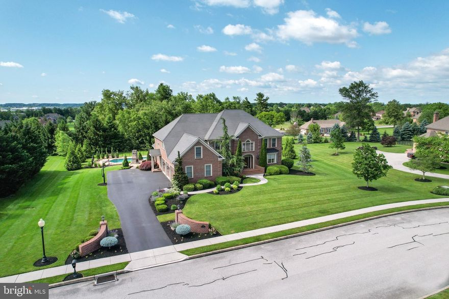 This gorgeous home is a must see!! The first floor boasts a gourmet kitchen with granite, cherry cabinets ,high end SS appliances including full size monogram refrigerator and freezer, butlers pantry, eat in table space, bar seating at the huge island, formal dining room with lighted tray ceiling , living room and family rooms with see through gas fireplace! Brazilian cherry flooring throughout most rooms, curved open staircase in foyer plus a back staircase behind kitchen, mudroom and private office with builtins!   2nd floor  features primary BR with tray ceiling, deluxe newly remodeled BA with smart home features, double sinks with light up mirrors, walkin marble shower, modern free standing tub, huge walk in closet with all the builtins, 2nd BR has it's own BA  and walk in closet, 3rd & 4th BRs  share the hall BA, Laundry room with builtin cabinets and countertops with deluxe washer and dryer! Full finished basement with media room including screen and projector, 5th BR and full BA, exercise room, Full bar  with beer tap and wine cellar, refrigerator and dishwasher! Exterior features go on and on also with a hot tub, inground pool with entertaining area, outdoor fireplace, covered patio with ceiling fans, plenty of lush yard and professional landscaping! 
 BE SURE TO READ LIST OF EXTRAS IN DOCUMENTS!

Watch for professional pics coming 5/29!