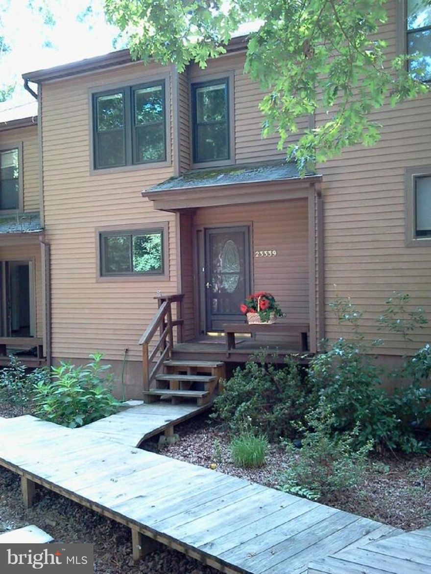 Lovely 3BR, 3 1/2BA in desirable Wildewood community; Remodeled with bamboo flooring on main and upper levels; Fresh paint; New windows; Wood burning fireplace includes approx 3 cords of seasoned firewood; Large deck; Finished basement with walkout; 'Built ins' upstairs and down; 1 Yr Home Warranty