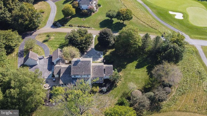 Located in the rolling hills of Chester County, Pennsylvania, this unique home is custom built in a private enclave surrounded by country ambience. The lifestyle is defined by the Hartefeld National Golf Course, which meanders by the lake, by the walking trails throughout the community, and by the inviting clubhouse: a social hub that offers casual elegant dining and fun gatherings.

What distinguishes this architect-designed home is the quality of the construction, the carefully considered floor plan, and the authentic detail that faithfully executes the replication of a 19th century, Pennsylvania farmhouse. Built on 1.3 acres, this house occupies one of the largest sites in the community- one that boasts unusual privacy and broad views of the fairway.

This lovely stone and clapboard home features reclaimed random-width pine floors; period mantles on two fireplaces; period cabinets; paneled walls, rich decorative millwork; and Bernardon-designed architectural details that will charm even the most discerning buyer.

Features include 4,000 square feet of living space on three levels, with a first floor master suite in a separate wing, convenient home office with a wall of built in file cabinets; large formal dining room; updated expansive eat-in kitchen with top-of-the-line appliances including Viking  gas stove and SubZero refrigerator; family room with fireplace and access to large; screened porch overlooking fairway; recently updated custom powder room; four-zone HVAC and state of the art water filtration systems. Walkout lower level has 10-foot ceilings, brick floors, large family room open to covered patio, full kitchen and bath.  Three huge upstairs bedrooms are complete with two full bathrooms.  Detached two-story barn boasts a bar for football weekends and workout space. The two  garages accommodates  three cars. A massive outdoor, hardscaped patio is integrated into the landscape with an elevated fire-pit area overlooking the 7th hole at historic Hartefeld National... and perfect for sunsets!!!  

The mandate to pre-eminent architect, Art Bernardon, was to create a home that embodies the character of period architecture, one that created the warmth of a 200-year-old farmhouse rooted in the land. And so, he did. Brilliantly.

 It is extremely rare that such a unique, customized, historic gem becomes available. Act fast!