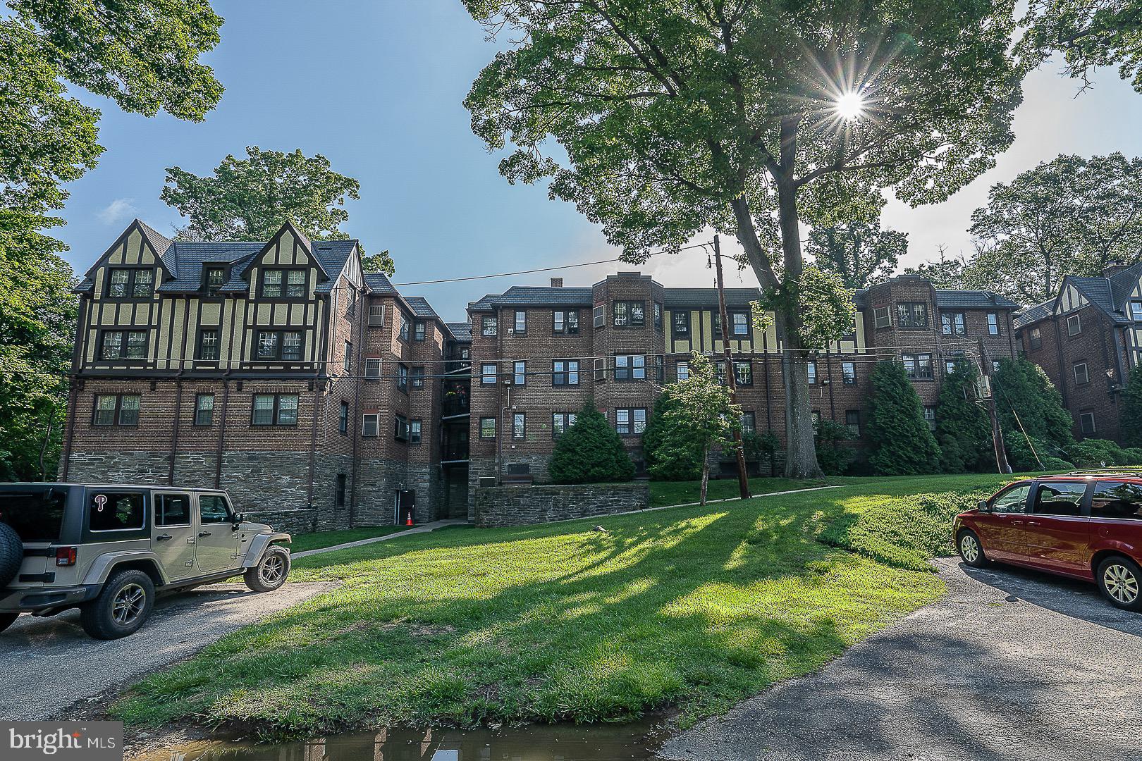 Large and bright condo unit on the 2nd floor in the beautiful and Elegant English Tudor York Lynne Manor in Lower Merion. This sunny 1,880 sq ft unit has 2 large bedrooms, a large den that can be converted into a bedroom or an office, 2 full bathrooms, great kitchen with breakfast room , formal dining room and a huge Living Room with fireplace. The main bedroom has a full private bathroom with a walk in closet, full hallway bathroom with shower, linen closet, washer and dryer in the unit, beautiful hardwood floors throughout. Newer Heater. Unit is in a quiet location towards the back of the building. The gated front entry way opens to a stunning courtyard with a fountain and gardens with benches to enjoy the sunshine. Great location! Convenient to all major transportation, Route 76, SJU and Center City. Unit comes with one garage parking space.