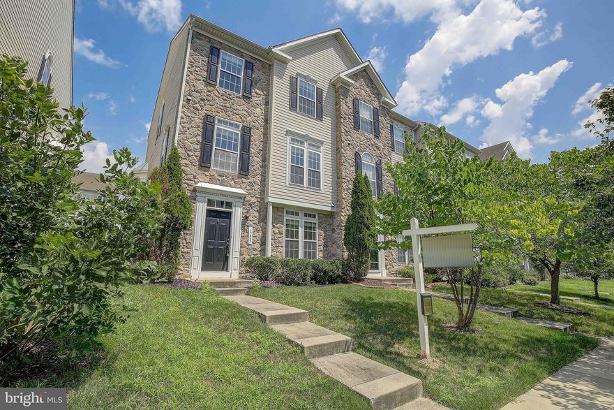 Welcome to the Villages of Dorchester! This Beautiful End Unit Townhome is at the center of a stunning community. This three level townhome is flooded with natural light. Upon arrival you will find a rear facing two car garage. The entry level has a large den with beautiful French doors and a welcoming foyer. The large living room is anchored by  an inviting stone fire place. The large kitchen boast an impressive island, wall oven and large dinning area. Just off the kitchen you will find a large maintenance free deck. The owner's suite features an eye catching tray ceiling and an impressive en suite  bathroom. This well maintained home  is located within walking distance to many restaurants, bars and shops. Just minutes away from Arundel Mills this home offers a quick commute to Fort Meade or Washington DC.