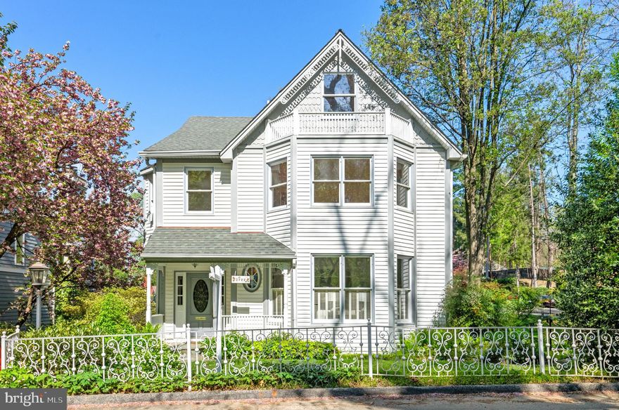 Ideally located on a sought-after street in Kent, this residence sits on a spacious combined lot of .33 acres.  The home's charm and character is immediately evident upon entry, where a welcoming foyer and views to the rear of the house.  The main level offers an air of comfort, presenting a desirably designed floor plan that balances generously scaled formal rooms with inviting family living spaces. Throughout the home, all rooms are filled with an abundance of natural sunlight from oversized windows. The living room features a lovely fireplace and is adorned with French doors leading to the dining room with wonderful views of the side lot. An open kitchen, replete with abundant cabinetry, seamlessly adjoins a breakfast room that offers deck access, providing a wonderful opportunity for indoor and outdoor entertaining. The impressive family room, with double height ceilings and a striking central stone fireplace, also provides deck access for an effortless indoor-outdoor lifestyle. The second level features three bedrooms and two full bathrooms, including the luxurious primary suite. The primary bedroom, generous in size and overlooking the rear grounds, is a haven of comfort. It is well-appointed with multiple closets, a spacious walk-in, and a private staircase leading to an exclusive third level that houses wonderful primary office and gym spaces. The sizable primary bathroom offers dual vanities, separate soaking tub, a shower, and linen closet. The additional bedrooms on this floor are spacious with large closets.The lower level extends the home's generous scale with an expansive recreation room with a fireplace, kitchenette, and built-ins. There are two additional bedrooms, a full bathroom, an oversized laundry room with a utility sink and ample storage, and direct access to the two-car garage from this floor. Outside, the rear deck provides a perfect setting for entertaining. The property conveys with an additional side lot to provide garden space and enhance privacy. The residence also enjoys access to a private community pool and tennis court. This exceptional offering is ideally positioned within close proximity to neighborhood restaurants, shops, and parks, promising a lifestyle of convenience on one of Kent's most coveted streets. Note: The side lot has an easement and cannot be built on.