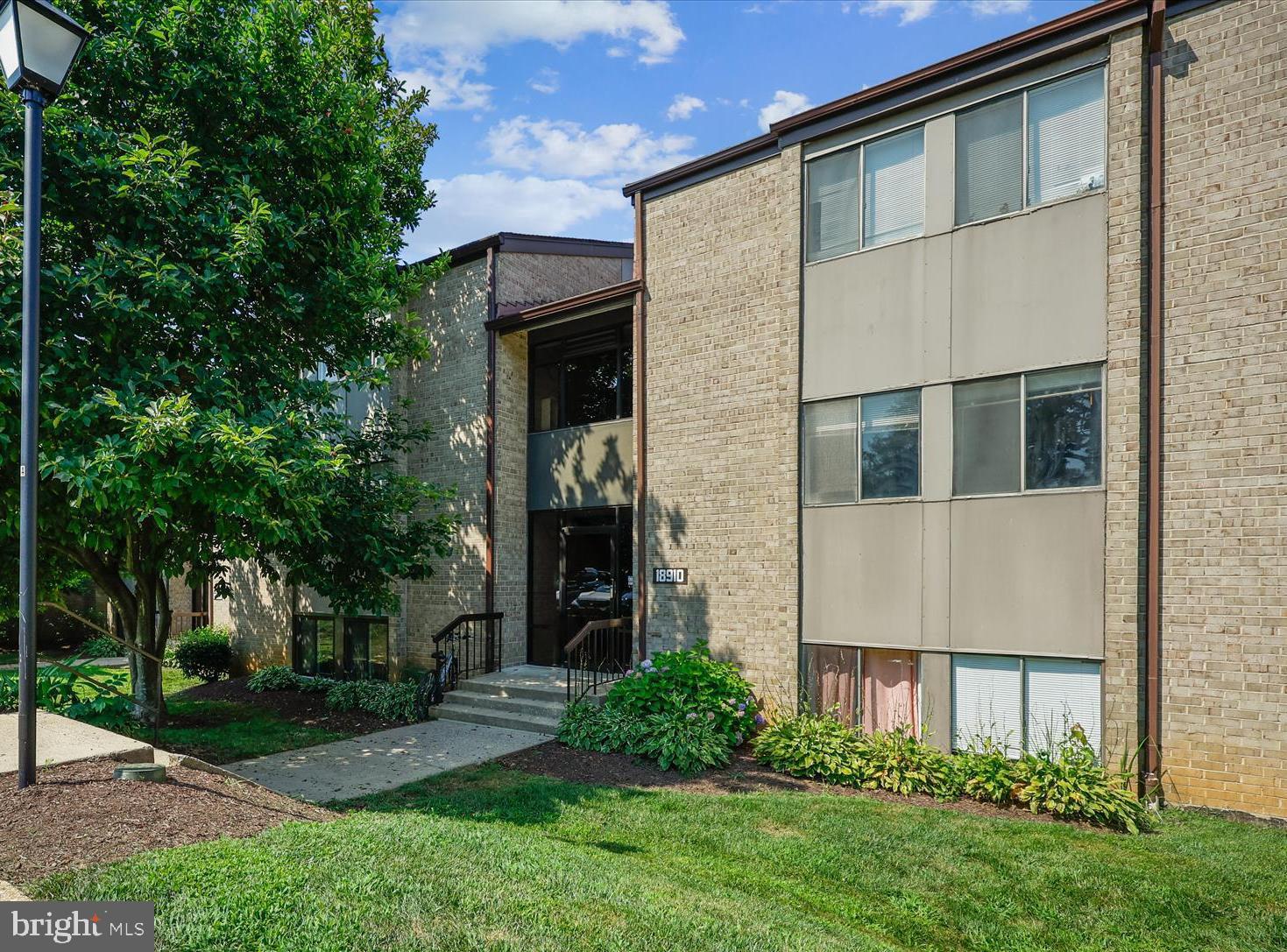 Welcome to 18910 Smoothstone Way, Apt. 1 – a beautifully updated ground level unit. This is a must-see unit with a peaceful, private location. Move-in ready, this two-bedroom and two full bath condominium is in the Heron's Cove community. It boasts new luxury vinyl flooring throughout and new carpet in the large bedrooms. The spacious living room boasts floor to ceiling triple sliding glass door that opens to an inviting covered patio with panoramic view of common grounds. Family and friends will enjoy a formal dinner or casual dining in the separate dining room with a new chandelier. The updated eat-in kitchen is a cook’s delight…beautiful maple cabinetry, quartz counters, ceramic tile backsplash and new Frigidaire stainless steel appliances (refrigerator, 5 burner gas range, dishwasher) plus new GE stackable washer & dryer and generous size pantry. The primary bedroom suite is spacious and includes new light upgraded carpet, large walk-in closet, and wonderfully updated ceramic tile bath with vanity and shower. The second bedroom with new light upgraded carpet is generous in size and has a large wall closet. Convenient ceramic tile hall bath with tub/shower has also been updated. Oversized hall linen closet. Additional updates to the condo… it has been freshly painted, base moldings have been replaced, new blinds, updated windows and new lighting throughout. With its neutral décor, this unit is move-in ready for the buyer that demands perfection. Excellent location…short stroll to the community pool, next to Montgomery Village Shopping Center, restaurants and additional shopping close by. Minutes to Marc Train, Shady Grove Metro, I 270, Rt 355 and public transportation. Condominium fee includes electricity, gas, and water.