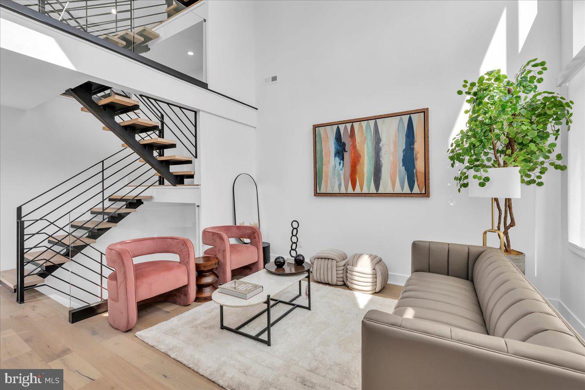 Welcome to 2618 E Hagert Street, a beautifully designed 3 bed, 3 bath townhome located in the vibrant Fishtown neighborhood. This modern residence offers over 3,100 square feet of thoughtfully crafted living space, combining clean, contemporary design with comfort and functionality —and it comes with the added benefit of a 10-year tax abatement, offering long-term savings for the new owner.
Step inside to discover an airy open layout featuring high ceilings, wide-plank hardwood floors, and oversized windows that flood the home with natural light. The main level features a stunning custom kitchen with quartz countertops, a large island, sleek cabinetry, and stainless steel appliances. While the kitchen and living room are separated by two levels, the design maintains an open, connected feel, giving each space a distinct identity without sacrificing flow—perfect for entertaining or relaxing.
Upstairs, the luxurious primary suite offers a peaceful retreat with a walk-in closet and spa-like ensuite bathroom with a double vanity, floating tub, and glass-enclosed shower. Two additional bedrooms provide ample space for guests, home offices, or growing families. The fully finished basement adds even more versatility, perfect for a media room, fitness area, or creative workspace.
One of the standout features of this home is the expansive rooftop deck, offering unobstructed views of the Philadelphia skyline and Ben Franklin Bridge—an ideal spot for entertaining. An attached garage adds rare convenience in the city, providing secure parking and additional storage.
Located on a quiet residential block just steps from the heart of Fishtown, this home offers easy access to neighborhood favorites like Reanimator Coffee, Green Eggs Café, Loco Pez, and the new Anna & Bel Hotel. With close proximity to I-95 and the L train, the location of 2618 E Hagert makes for an easy commute to anywhere in the city and surrounding areas.
This is modern city living at its best—schedule your private tour today.