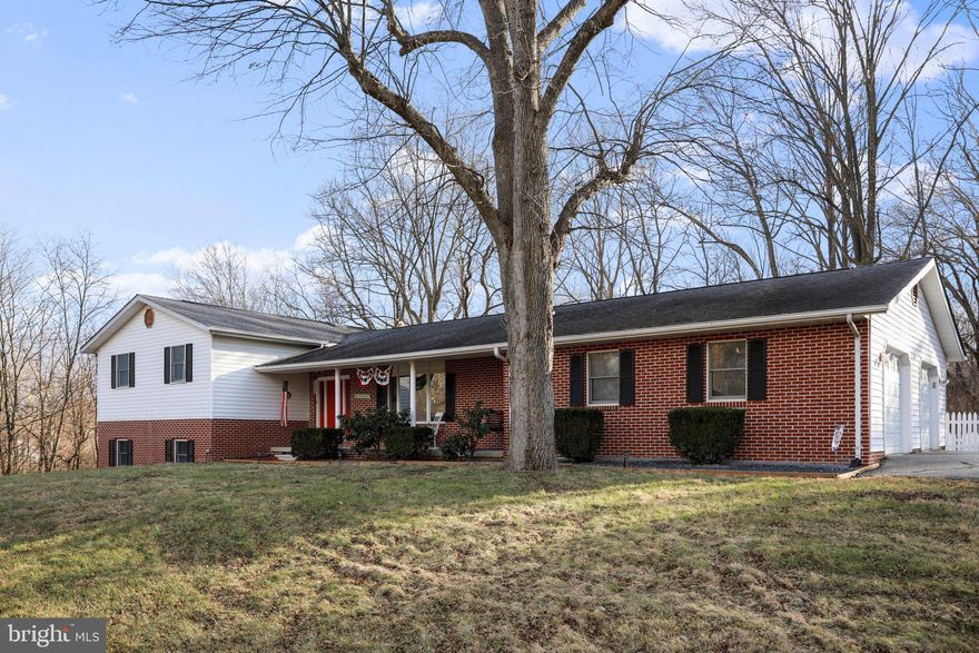 Total Convenience- location just minutes away for commuters.  Paved Roads, you will love this small subdivision tucked away off Route 11.  Over 2.5 Acres and 5 bedrooms make this home ideal in so many ways.  If you are looking to work from home, use a room or two as an office, there is not a shortage of space.  Sit outside and enjoy the established bird visits.  This two car garage has a dream workshop area.  Freshly painted home with some carpet updates too.  The family room has a woodstove that conveys.  
The driveway is paved and has nice circle pass thru.  Plenty of parking.  Property has been landscaped with a portion fenced.  The front porch has room to sit out and enjoy.  Schedule now to see.