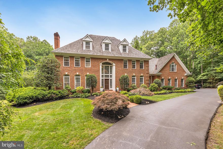 Stunning custom built 4 level all brick Georgian colonial on 5 acres with electronic gated entrance and circular driveway. This home is full of charm and spaciousness from top to bottom.  You will immediately be impressed as you drive up to the front door. As a new owner you will plan to spend your warm days in the backyard where you will find a pool/entertainment oasis beyond description with multiple patios, brick paver pool deck and Olympic sized 25-60 foot pool with diving board.  A stone and iron fence surrounds this area with upper and lower grill areas and fountains. 

Once you are finished being mesmerized by the exterior, step inside to find a two-story foyer and let your eyes take in this expansive space with nearly 8,000 square feet of splendor. The home has numerous updates including a gourmet chef’s kitchen with high-end stainless steel appliances, extended center island, 42” cabinets, pantry and everything you would need to throw a fabulous dinner party. In addition to the kitchen, you will find on the main level a large step-down living area with one of four fireplaces, a separate dining area, an office space with custom-built shelving, a sitting room/library with fireplace, a breakfast room and more. The main level is completed with wide plank hardwood flooring, crown molding, and French doors leading to the exterior rear deck. 

As you work your way up to the third level you can take one of two staircases. Here you will find an enormous light filled primary suite with wood flooring, updated spa-like bathroom and additional fireplace. There are three additional ensuite bedrooms on this level. On the fourth level you are greeted by a huge additional 5th bedroom with large walk-in closet and full bath. 

The walkout lower level has a custom wine room, lower custom bar perfect for any type of social gathering, a workout space, additional fireplace and game area.  Additional highlights of the home include an oversized side load three car garage, a koi pond and numerous other special features. This home is move-in ready.