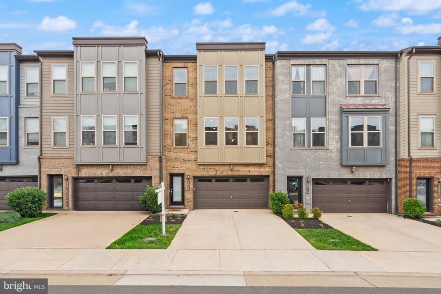 Welcome to 9874 Buchanan Loop, a beautifully designed 4-bedroom, 3.5-bath townhome in the heart of Manassas. With a modern layout, stylish upgrades, and a fantastic location near downtown Manassas, the farmer’s market, and 2 Silos Brewing, this home offers both convenience and charm. Plus, with an incredibly low HOA fee, it’s a rare find.

The entry level features a garage, bedroom, full bath, and extra storage, with access to the custom patio and fenced back yard. Upstairs, the main living space is bright and open, with a spacious kitchen featuring double ovens, a cooktop, and a large island that flows seamlessly into the dining and living areas. A private deck extends the space outdoors, perfect for morning coffee or relaxing evenings. A half bath on this level adds extra convenience.

The top floor is home to three bedrooms and two full baths, including a primary suite with a beautifully upgraded tiled shower, generous living space, and walk-in closets. Designed for both comfort and functionality, this home offers plenty of room to spread out while maintaining a warm, inviting feel.

With a prime location close to shopping, dining, and entertainment, this home is the perfect blend of modern living and everyday convenience. Schedule your tour today and see what makes this property so special!