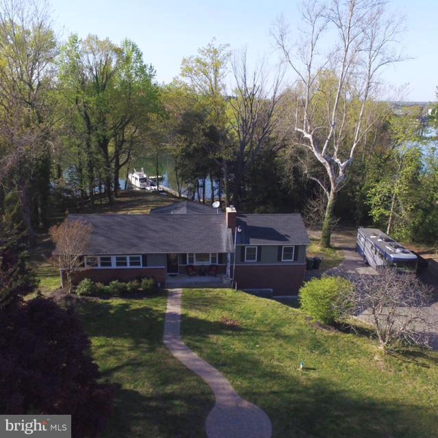 This Stunning Waterfront home is in the heart of the St Mary's but tucked away for privacy. This beautifully updated 3 bedroom, 3 bath home offers breathtaking water views and year round comfort. Featuring three spacious living areas, including sunroom, this property sits on 2.62 acres along a protected creek with deep water access - perfect for boating enthusiasts! The private pier is equipped with electric and a boat lift.
Seller upgraded roof, windows, well and septic system, ensuring peace of mind for years to come. Additional highlights include a 2 car garage, and extended Amish built shed, and a relaxing hot tub. Enjoy watching eagles and ducks in every season from your waterfront oasis. There is a VA assumable loan as well as we are approved/perc for a 2000 sq foot house however, you will need to go through county for building permits.