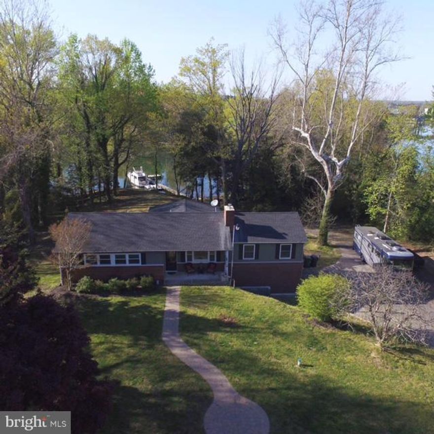 This Stunning Waterfront  home is in the heart of the St Mary's but tucked away for privacy.  This beautifully updated 3 bedroom, 3 bath home offers breathtaking water views and year round comfort.   Featuring three spacious living areas, including sunroom, this property sits on 2.62 acres along a protected creek with deep water access - perfect for boating enthusiasts!  The private pier is equipped with electric and a boat lift.

Seller upgraded roof, windows, well and septic system, ensuring peace of mind for years to come.  Additional highlights include a 2 car garage, and extended Amish built shed, and a relaxing hot tub.  Enjoy watching eagles and ducks in every season from your waterfront oasis.  There is a VA assumable loan as well as we are approved/perc for a 2000 sq foot house however, you will need to go through county for building permits.
