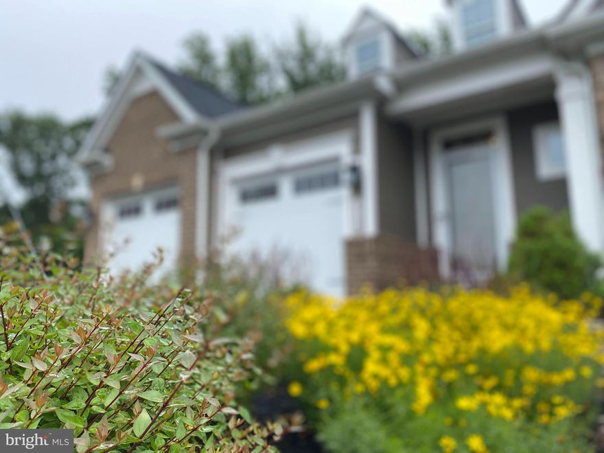 Welcome to Fairways South in luxurious Turf Valley. This 4300 sq foot end of group home sits on the absolute best homesite in the neighborhood. It’s situated in a lovely open cul de sac with parking and backs to the county owned David Force Park. Which means you’ll have lush green privacy forever and great walking trails right in your backyard. The common space is incredibly generous between the next group of homes and is maintained by the HOA. 

Your 2 car garage offers 2 separate doors and plenty of ceiling height to add overhead storage. The floors have already been epoxied and the walls are painted and trimmed out making for a great inside/outside area when the neighbors want to gather for parties. The garage feeds through the laundry room and directly into the kitchen so groceries days are easy. Tuck everything into the walk in pantry and pristine stainless steel french door refrigerator and you’re done! 

The kitchen is bright and spacious and has a well thought out design. Built in 2019, the kitchen has been incredibly well cared for and it shows. You’ll first notice the beautiful, dual pendant chandeliers over the sizable island. The counters are all bright and sparkling quartz that pairs seamlessly with the 42” upper cabinets surrounding the kitchen walls. The lower cabinets all match in color and stand out with full wood dovetailed drawers and soft close hinges. Under cabinet lights brighten up all the counterspace and can be controlled in tandem or individually giving control for the mood you want to set.  The cooktop has 5 burners fueled with natural gas and the vent hood above is hidden in a custom cabinet making dinner is a snap. The microwave and wall oven are just where you want them.

Extra wide hardwood glistens throughout this open floor plan from your front door to the rear deck which overlooks the park and deep back yard. It also flows into the first floor owner's suite. This bedroom is amazing with the extra side windows, balcony access and tray ceiling. The attached bathroom offers dual vanities and an oversized roman shower with shower heads on both sides. The walk-in closet is conveniently off the bath as well and has been decked out by California Closet systems like all the closets in the home. 

 Built in 2019 this NV floor plan offers 3 upper bedrooms all designed around a central loft area great for lounging or game nights. You won’t hear a peep downstairs with this setup.  This home also has the easiest attic access... It's an attic you just walk into off the loft and it is huge.No ladders needed. The 9 ft ceilings continue upstairs to these spaces and into the basement adding to the size in a very subtle way.

The lower level is completely finished except for the 3 different large storage areas. Custom shelving was added and is a great way to show off memories. A full bath allows for part of the space to be closed into a 5th bedroom if you chose in the future. An additional full size window was added just for that case. A double wide glass patio door lets natural light pour into the space and opens out to a spectacular custom paver patio. It’s an entertainer's dream or keep this oasis all to yourself and enjoy all the birds, relaxation, and peace of mind you could ever hope for. Gutter guards protect your drains and your power is protected with a whole home natural gas generator.  Don’t miss out on this tremendous home in the fantastic Turf Valley community.